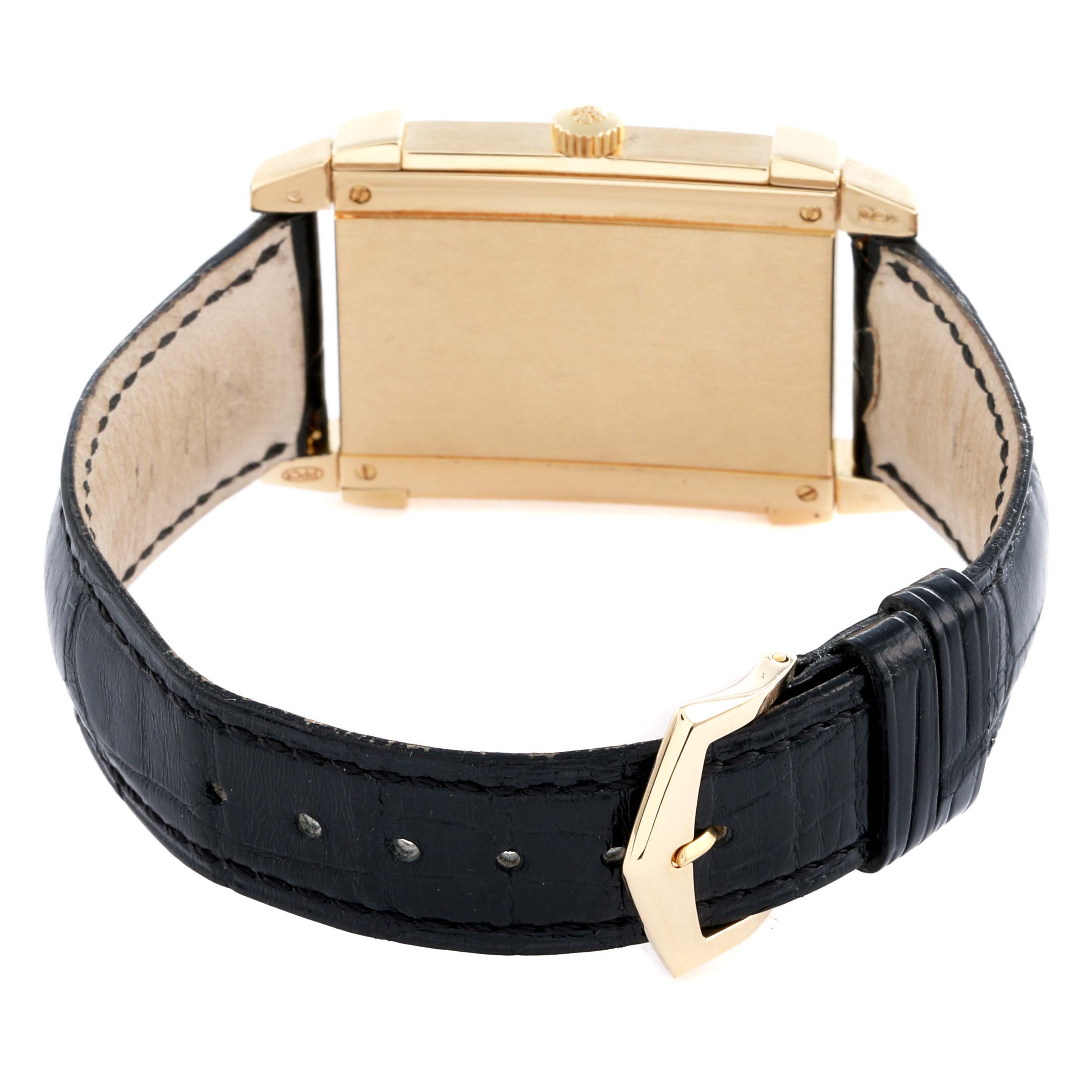 The image shows the back view of a Patek Philippe Gondolo 5111J-001 Men
s Yellow Gold Silver Dial watch, highlighting the gold case, crown, and black leather strap with buckle.