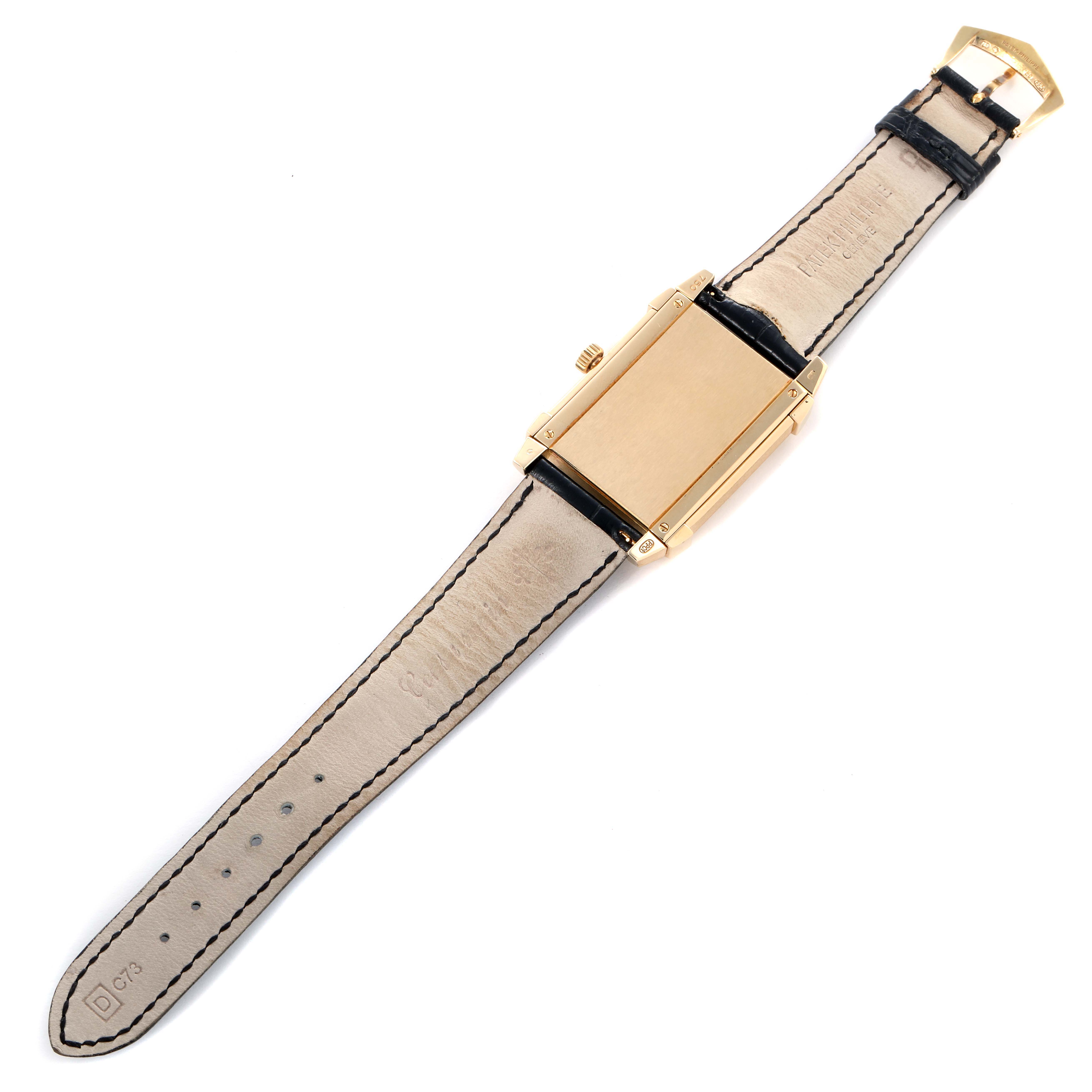 The Patek Philippe Gondolo 5111J-001 Men
s Yellow Gold Silver Dial watch is shown from the back, highlighting the case, strap, and clasp.