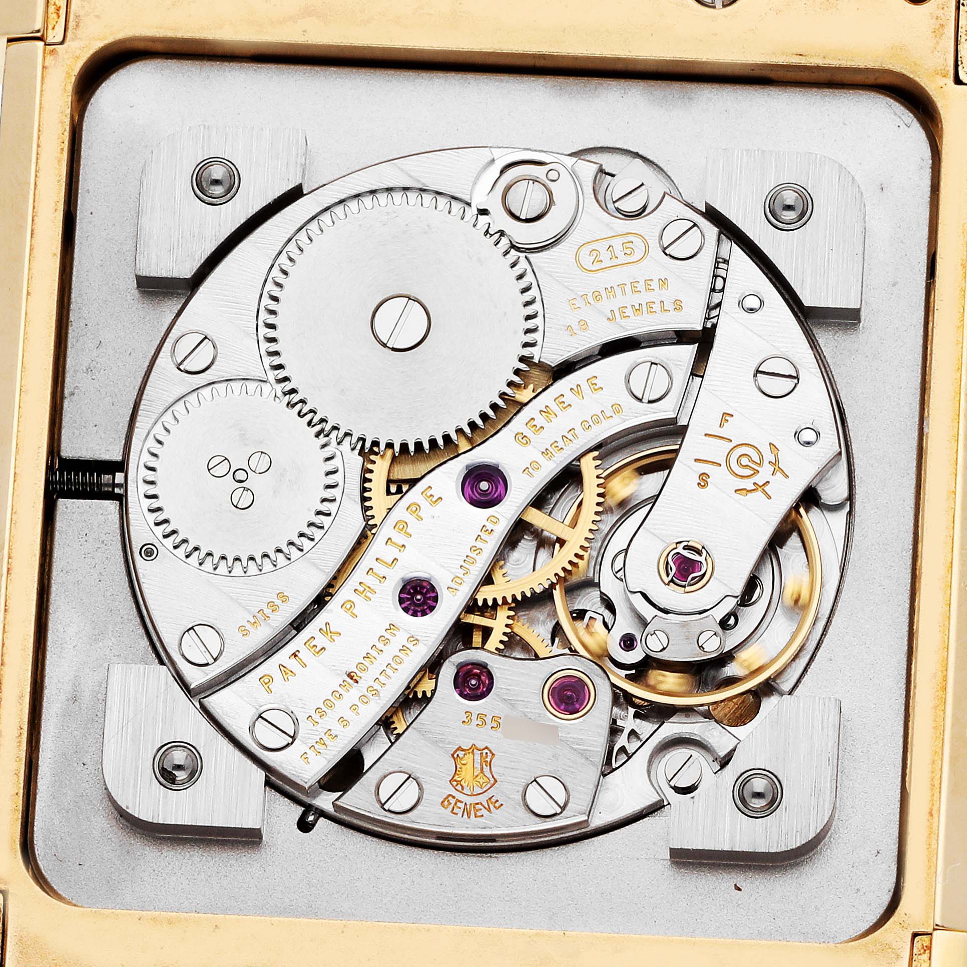 The image shows the movement of a Patek Philippe Gondolo 5111J-001 Men
s Yellow Gold Silver Dial watch, highlighting gears and mechanisms with an overhead view.