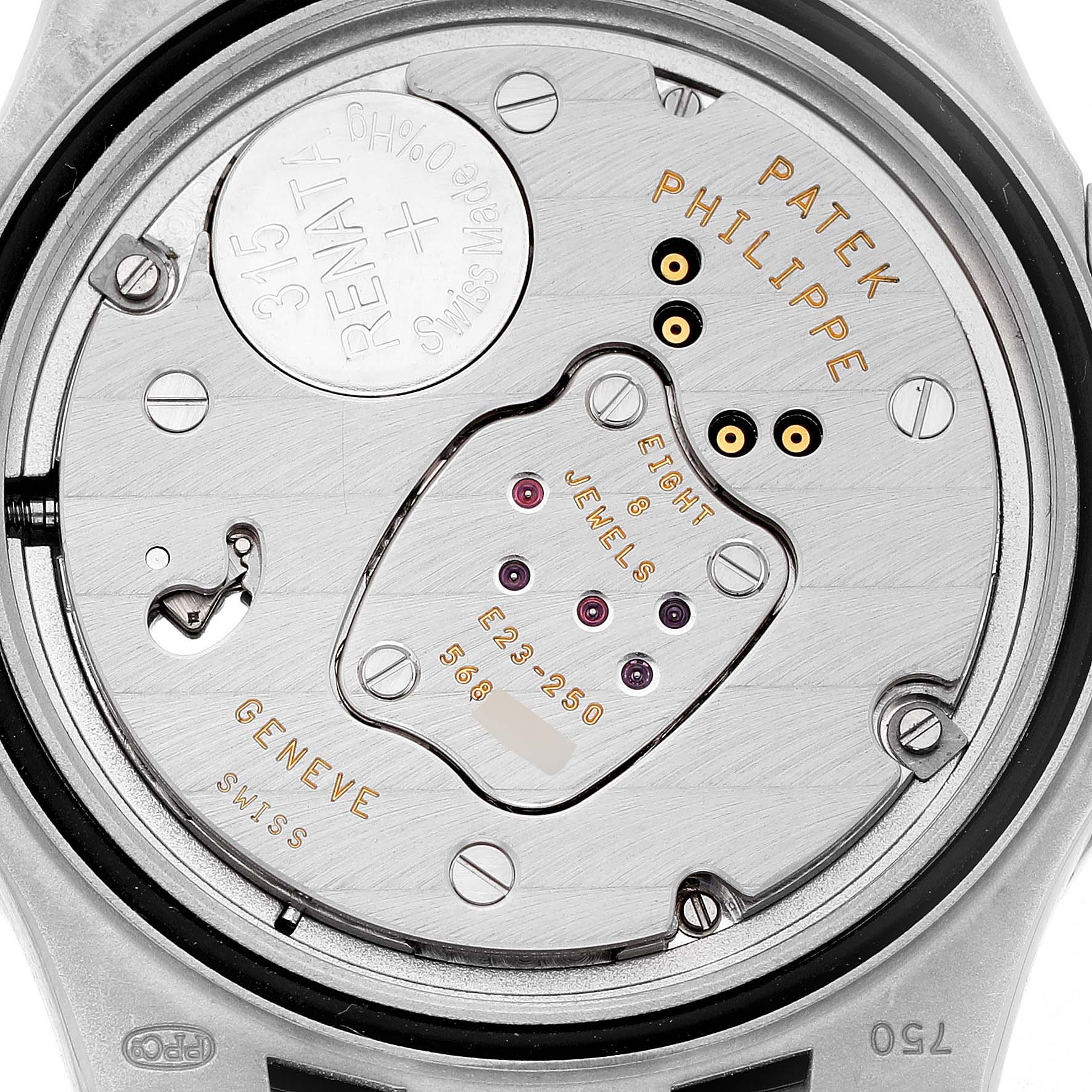 The image shows the back view of a Patek Philippe Nautilus 7010/1G-001 Women's White Gold Silver Dial watch, highlighting its movement and internal components.
