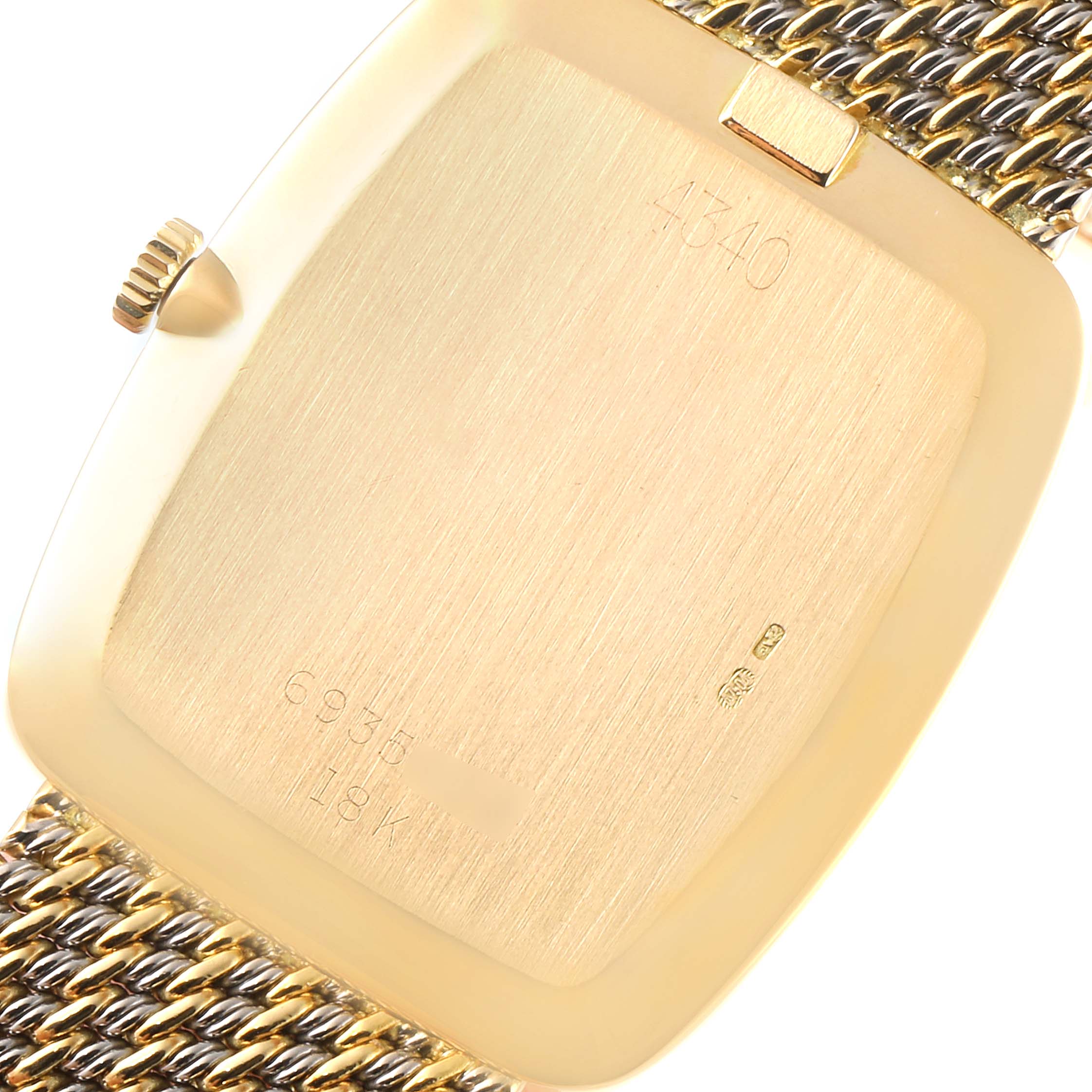 This image shows the back case, crown, and part of the bracelet of a Rolex Cellini 4340 Men's Yellow Gold Champagne Dial 4340 Men's Yellow Gold Champagne Dial watch.