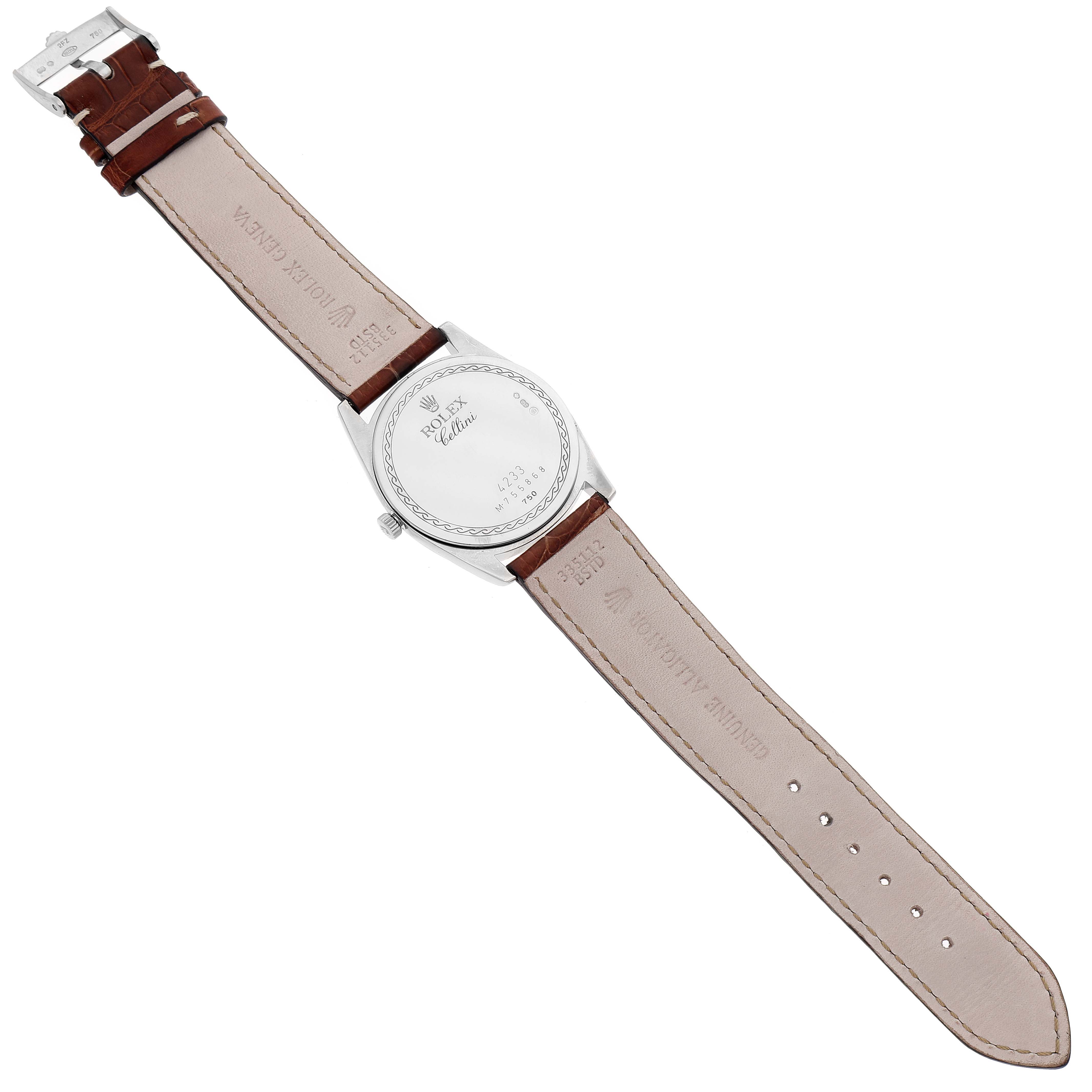 The image shows the back of a Rolex Cellini 4233 Men's Rose Gold Black Dial 4233 Men's Rose Gold Black Dial watch and its leather straps, viewed from a top-down angle.