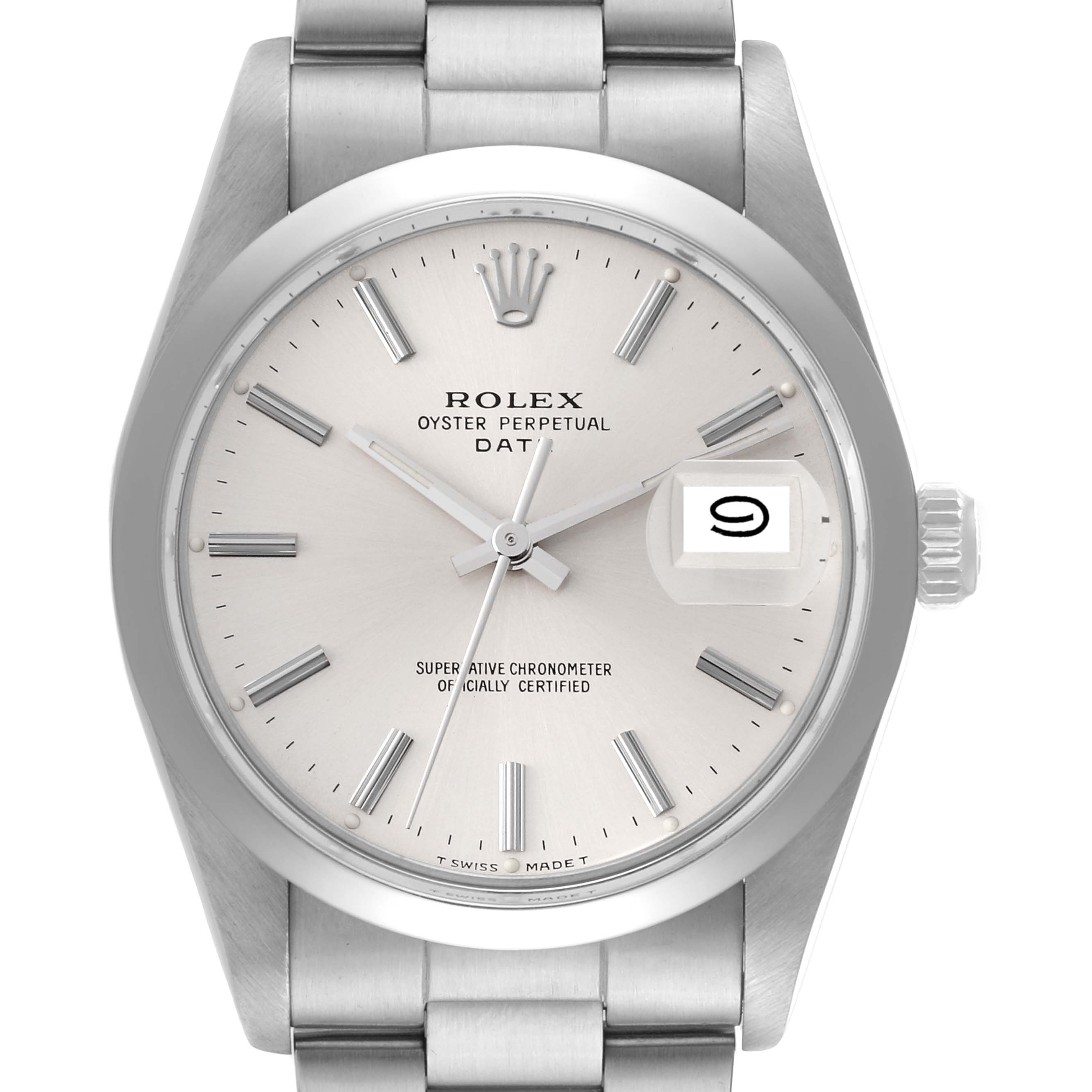 This image shows a close-up of the face, bezel, crown, and part of the bracelet of a Rolex Oyster Perpetual Date watch.