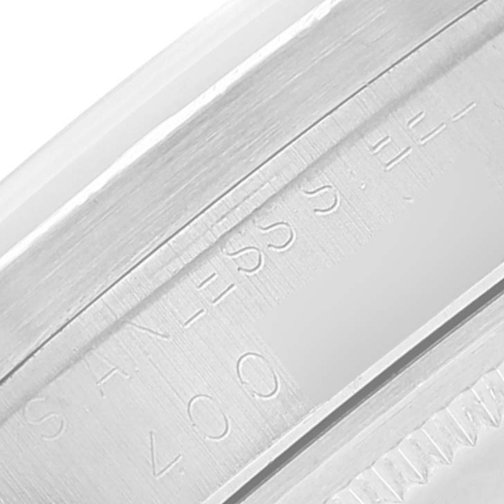 The image shows a close-up view of the stainless steel caseback edge of the Rolex Vintage Collection 1501 Men's Stainless Steel Silver Dial 1501 Men's Stainless Steel Silver Dial model watch.
