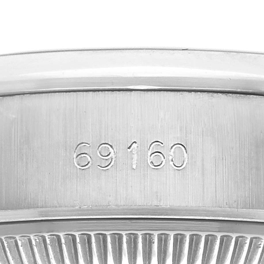 The image shows a close-up side view of the case of a Rolex Date 69160 Women
s Stainless Steel White Dial model, highlighting the reference number 69160.