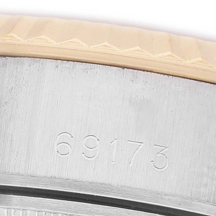 The image shows a close-up of the case side, including the model number engraving, of a Rolex Datejust 69173 Women's Steel and Gold (two tone) Champagne Dial watch.