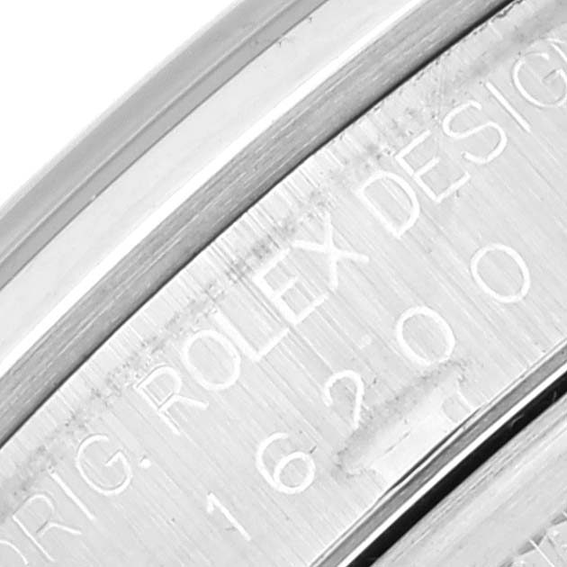 This is a close-up image of the engraved inscription on the inner case of a Rolex Datejust 16200 Men's Stainless Steel Black Dial 16200 Men's Stainless Steel Black Dial watch.