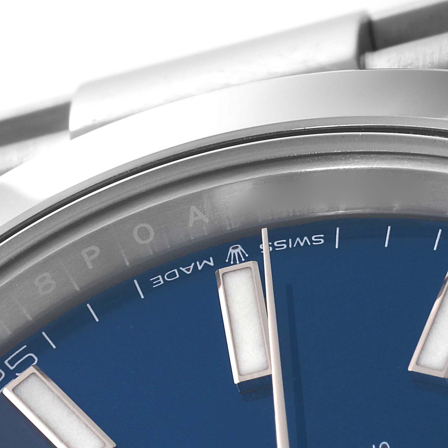 This close-up image of the Rolex Datejust 41 126300 Men's Stainless Steel Blue Dial 126300 Men's Stainless Steel Blue Dial model shows part of the blue dial, index markers, and a portion of the bezel.