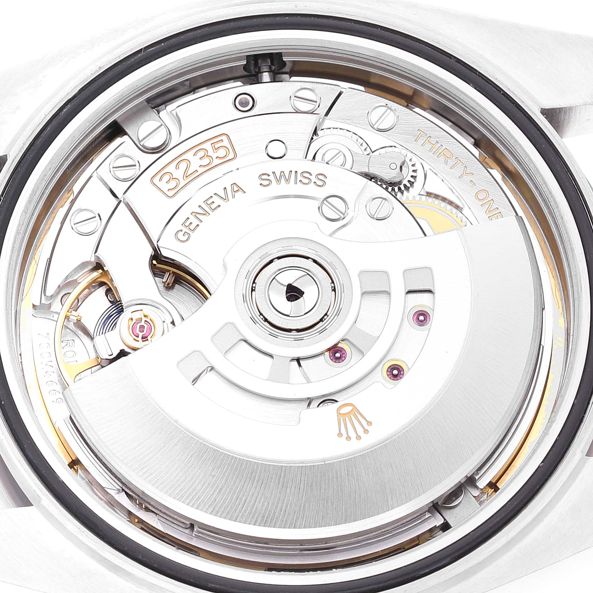 The image shows the internal mechanism of the Rolex Datejust 41 126334 Men
s Stainless Steel Mother of Pearl Dial 126334 Men
s Stainless Steel Mother of Pearl Dial watch viewed from the back, highlighting the caliber 3235 movement.