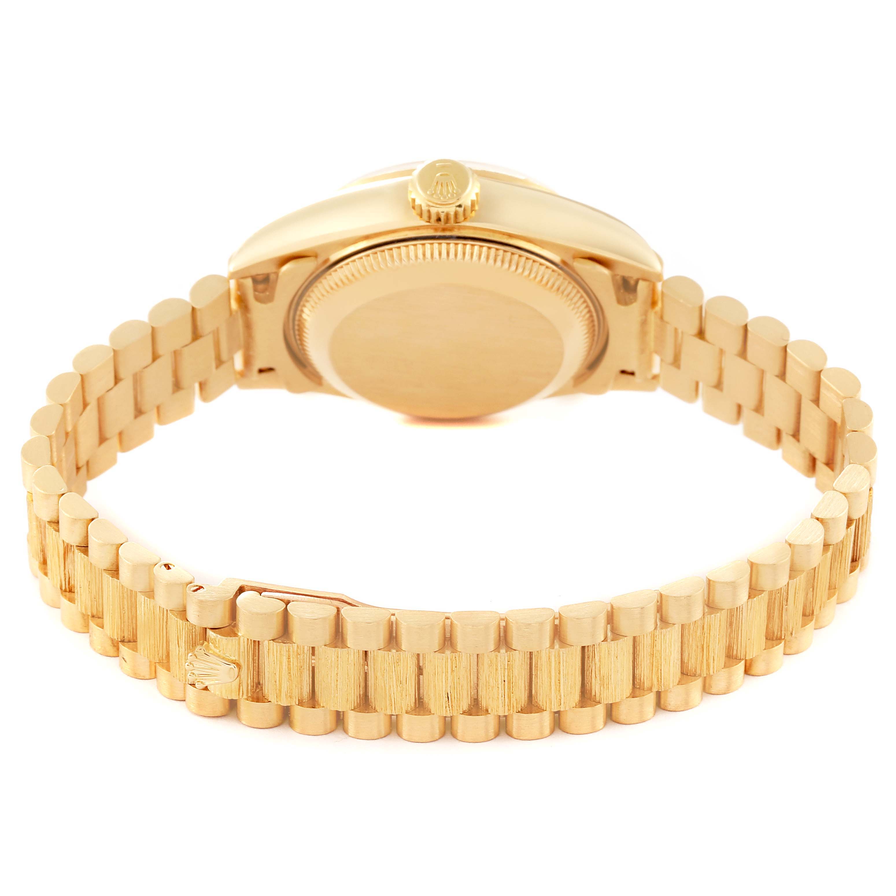 This image shows the back view of a Rolex President 69278 Women's Yellow Gold Champagne Dial 69278 Women's Yellow Gold Champagne Dial model, featuring the case back and gold bracelet.