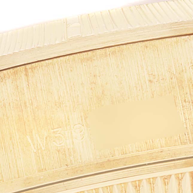 This image shows a close-up of the side of a Rolex President 69278 Women's Yellow Gold Champagne Dial 69278 Women's Yellow Gold Champagne Dial model watch, focusing on its engraved details.