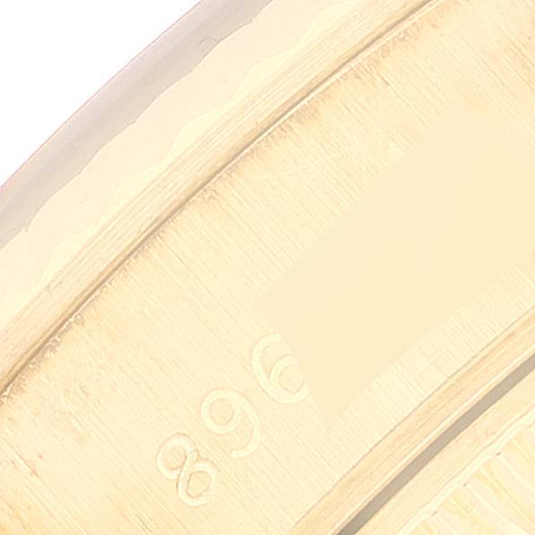 This image displays a close-up of the engraved details on the inner part of the Rolex President 69178 Women's Yellow Gold Champagne Dial 69178 Women's Yellow Gold Champagne Dial model watch case.
