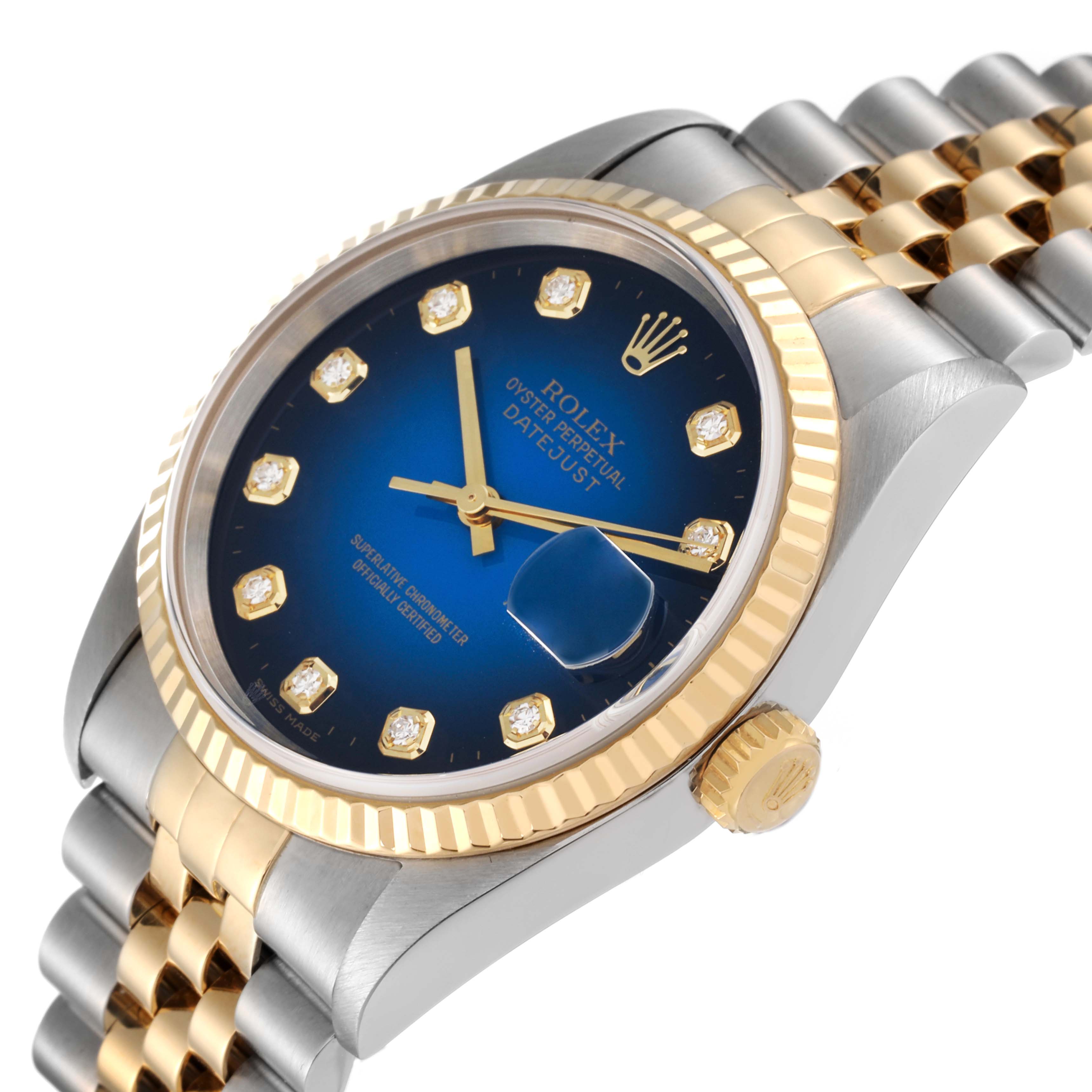 The image shows a close-up angled view of a Rolex Datejust 16233 Men's Steel and Gold (two tone) Blue Dial 16233 Men's Steel and Gold (two tone) Blue Dial watch, highlighting the dial, bezel, crown, and part of the bracelet.