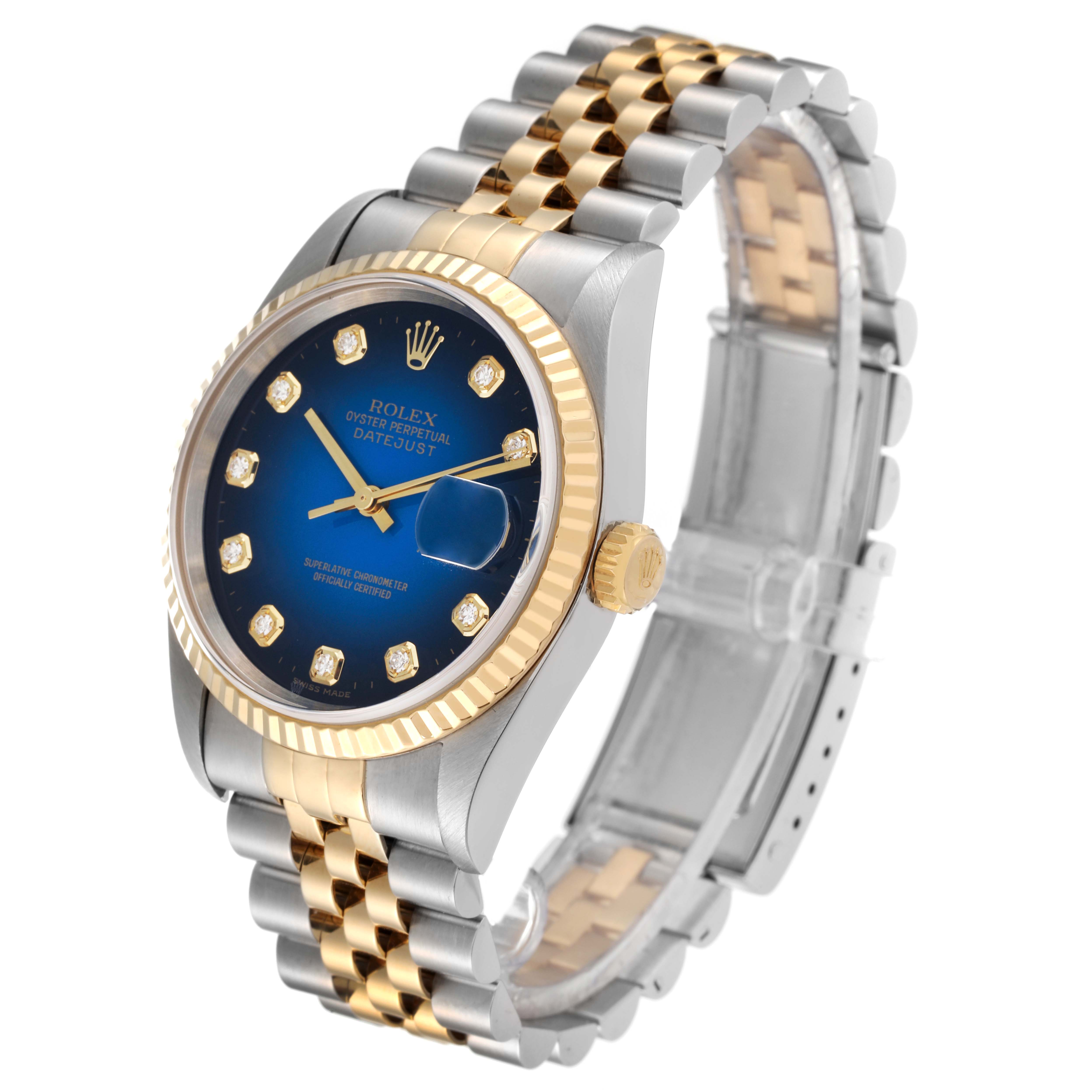 This Rolex Datejust 16233 Men's Steel and Gold (two tone) Blue Dial 16233 Men's Steel and Gold (two tone) Blue Dial watch is shown at an angled view highlighting its blue dial, gold fluted bezel, and two-tone Jubilee bracelet.