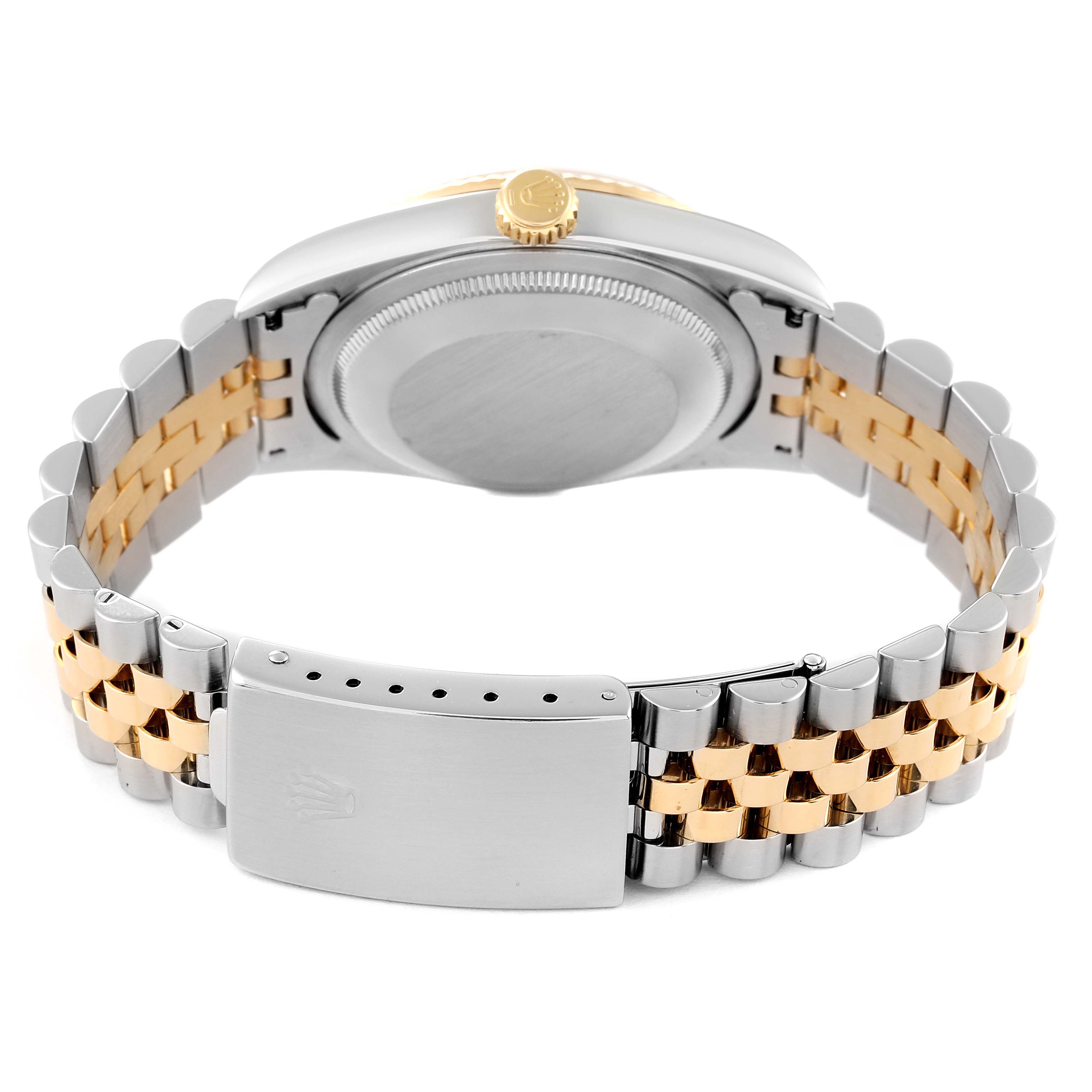 This image shows the back view of a Rolex Datejust 16233 Men's Steel and Gold (two tone) Blue Dial 16233 Men's Steel and Gold (two tone) Blue Dial watch, highlighting its case back, crown, and the two-tone bracelet with clasp.