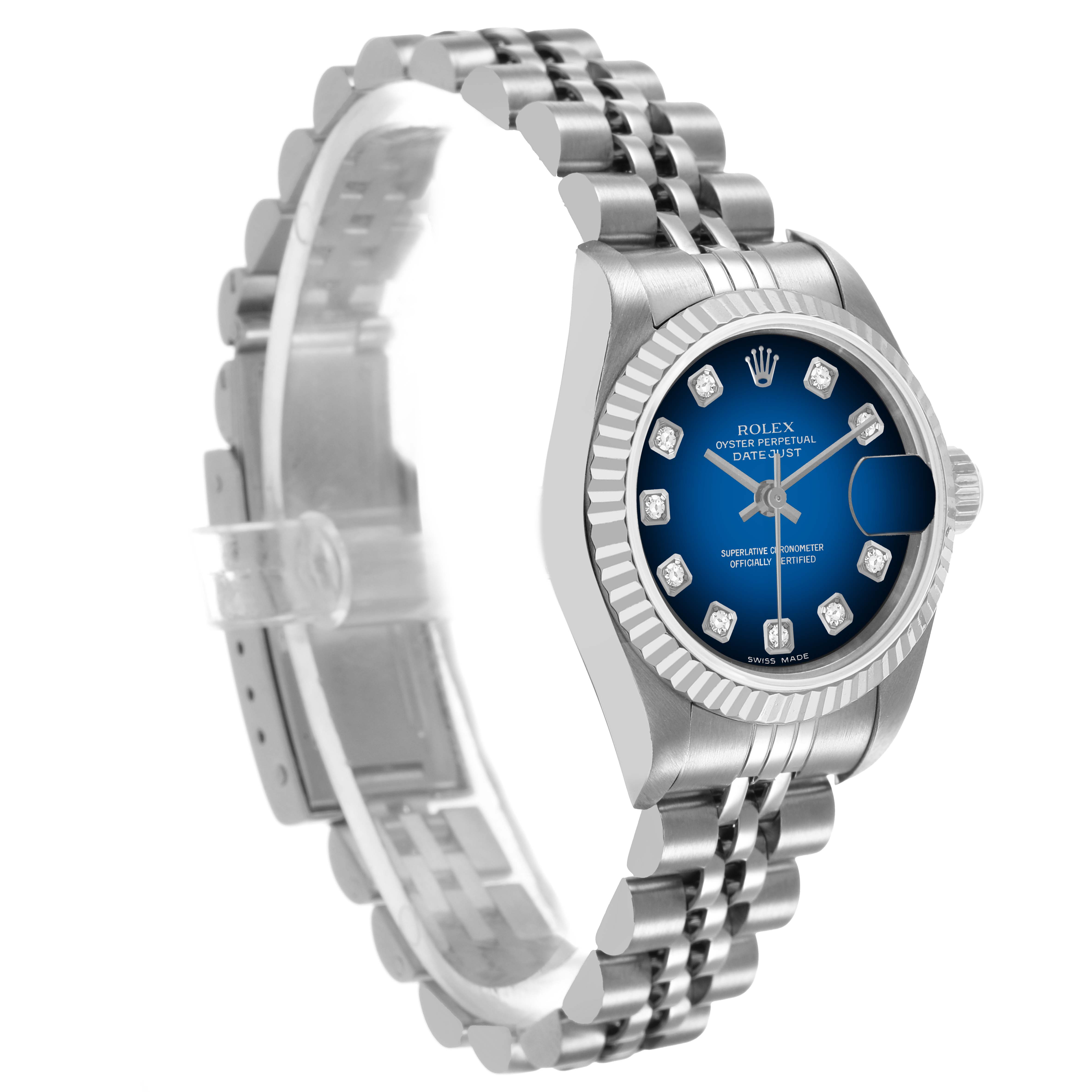 The Rolex Datejust 79174 Women's Stainless Steel Blue Dial watch is shown at an angle highlighting the blue dial, diamond hour markers, fluted bezel, and jubilee bracelet.
