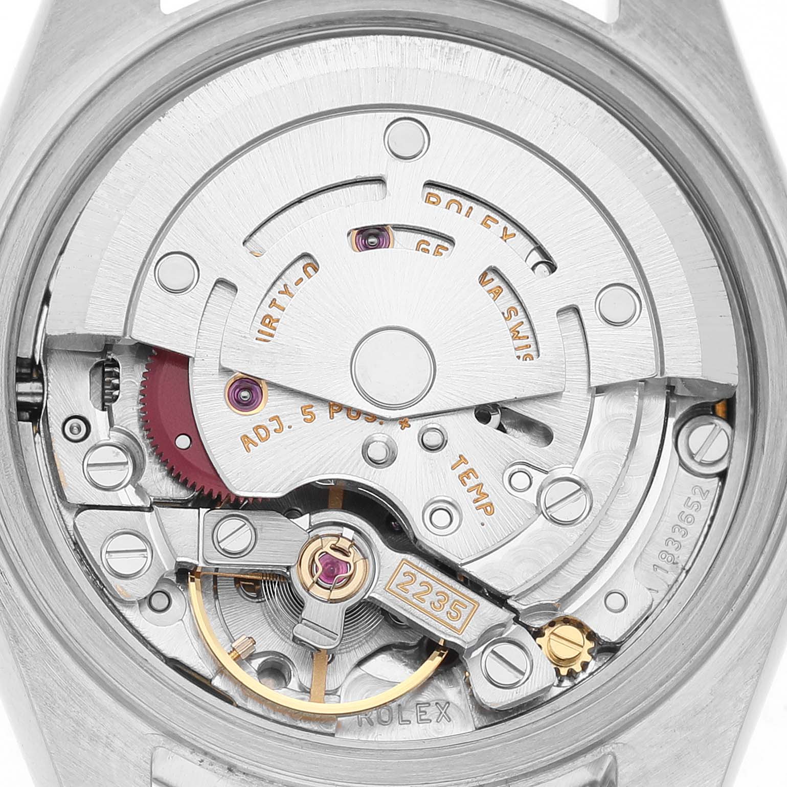 The image shows the movement of a Rolex Datejust 79174 Women's Stainless Steel Blue Dial watch from a back angle, focusing on its intricate mechanism.