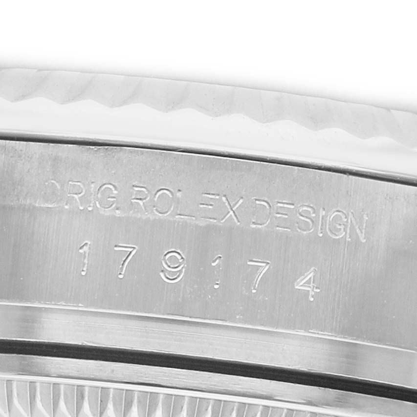 The image shows the case side of a Rolex Datejust 179174 Women's Stainless Steel Pink Dial, highlighting the engraved model number and design text.