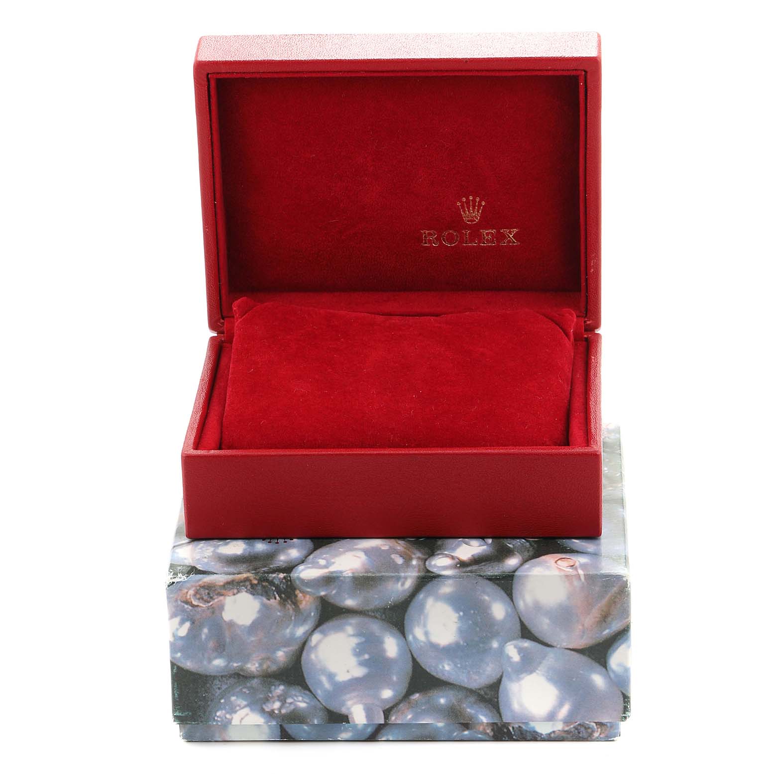 This image shows an opened Rolex Datejust 79174 Women
s Stainless Steel Silver Dial 79174 Women
s Stainless Steel Silver Dial watch box, revealing a red cushioned interior and the Rolex logo.