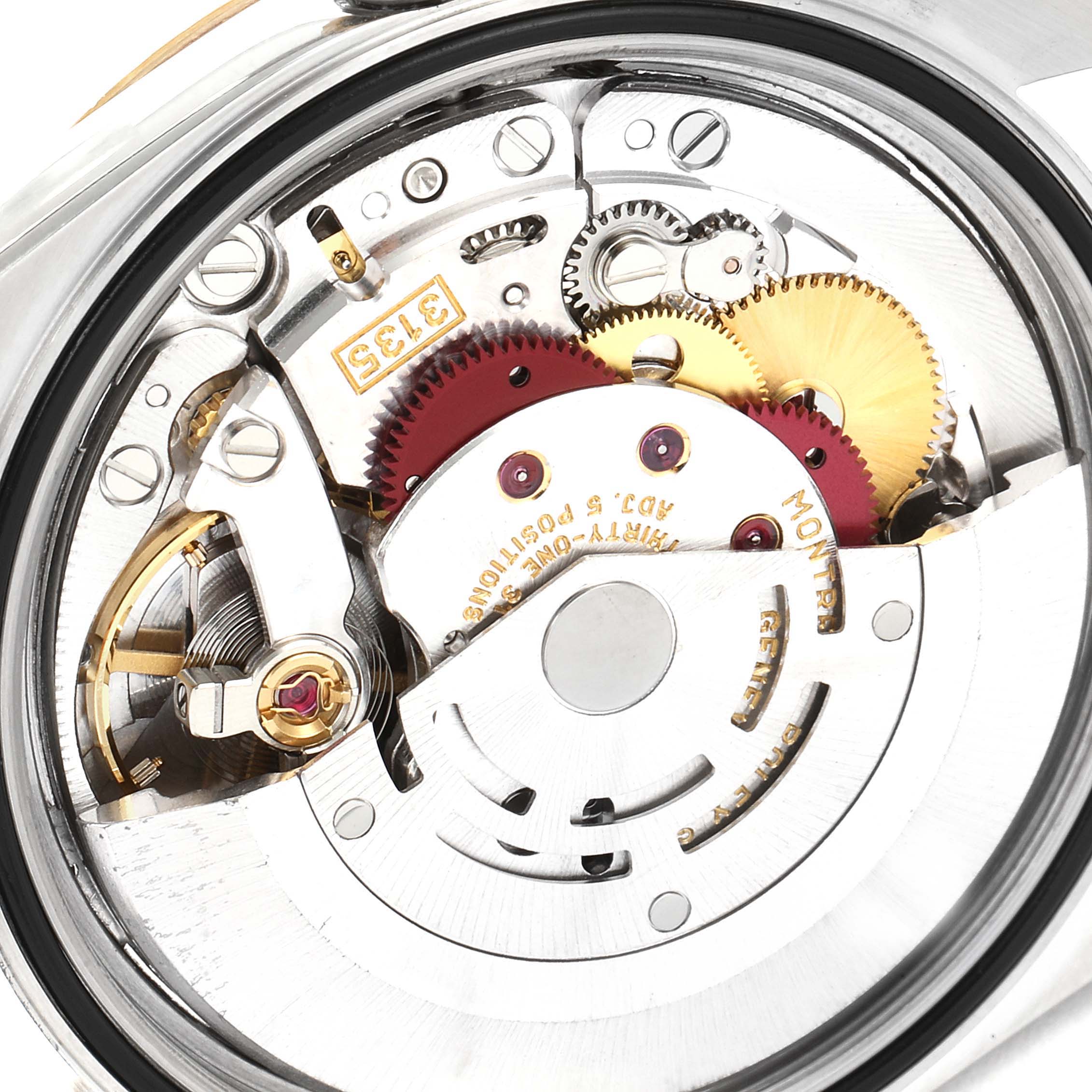 This image shows a close-up of the internal mechanism of a Rolex Datejust 16233 Men's Steel and Gold (two tone) Champagne Dial 16233 Men's Steel and Gold (two tone) Champagne Dial watch, highlighting gears and other components.