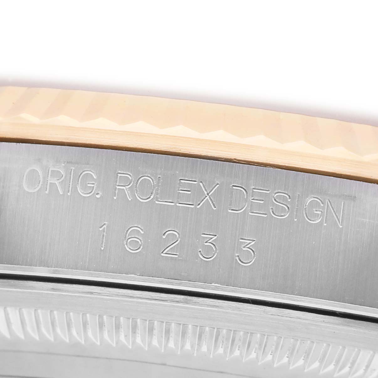 The image shows the engraved side of a stainless steel Rolex Datejust 16233 Men's Stainless Steel Champagne Dial case, displaying the model number.