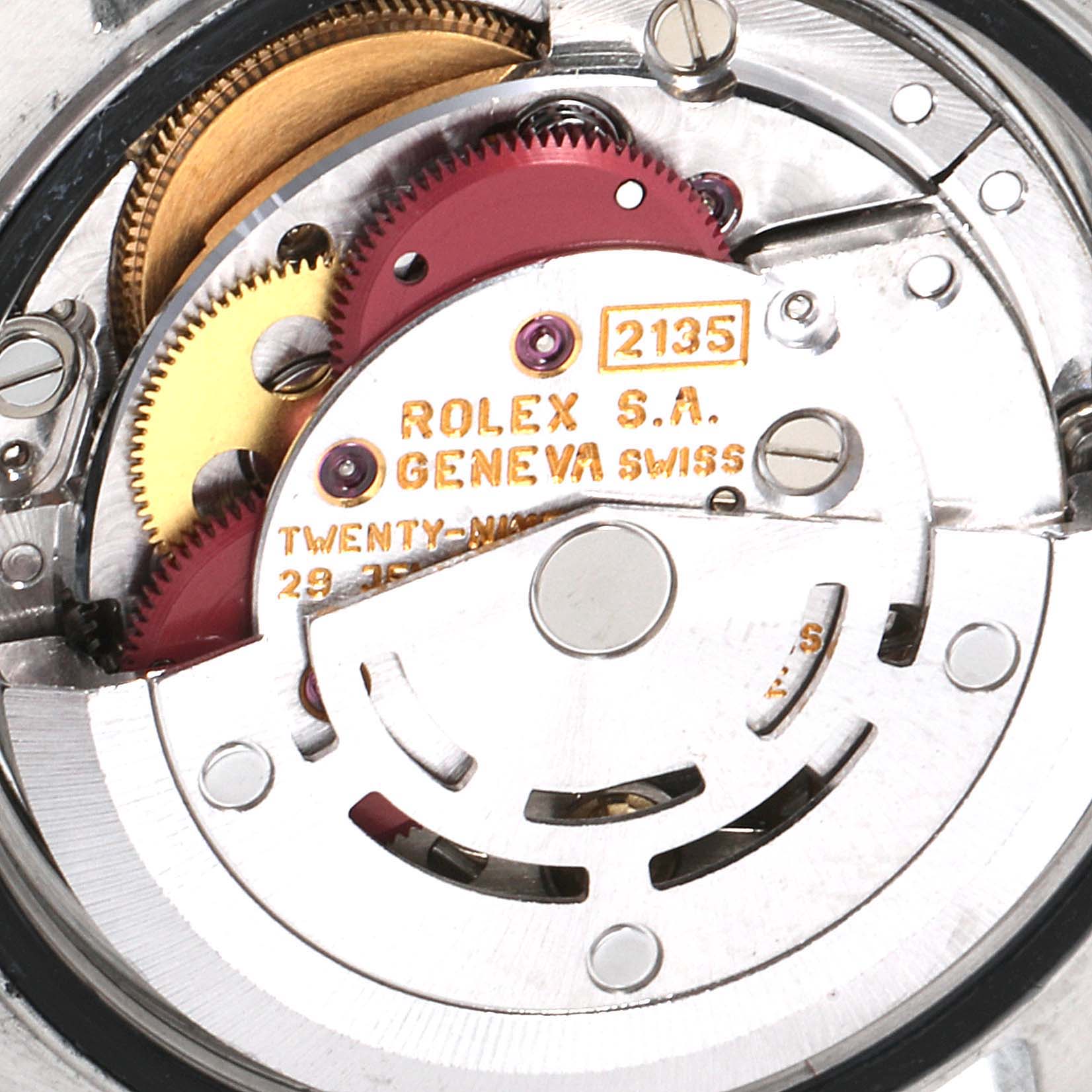 The image shows the internal mechanism of the Rolex Datejust 69173 Women
s Steel and Gold (two tone) Champagne Dial 69173 Women
s Steel and Gold (two tone) Champagne Dial watch, specifically its automatic movement and gears.