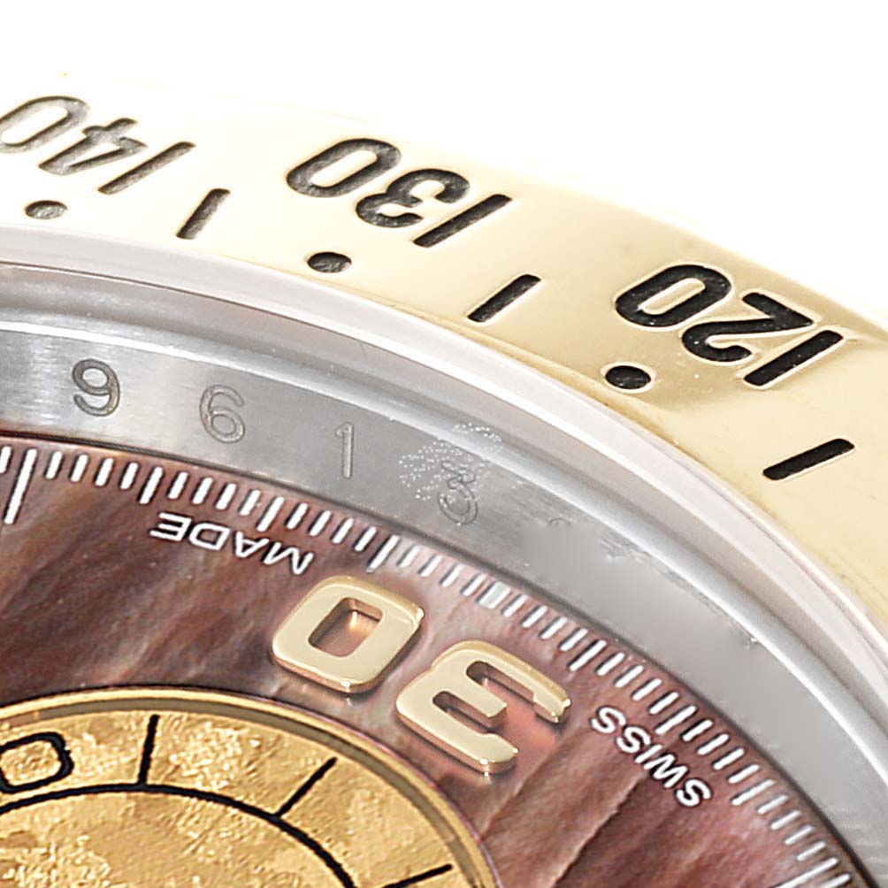 This image shows a close-up of the bezel and partial dial of a Rolex Daytona 116523 Men's Steel and Gold (two tone) Mother of Pearl Dial 116523 Men's Steel and Gold (two tone) Mother of Pearl Dial watch, focusing on the 30-second mark.