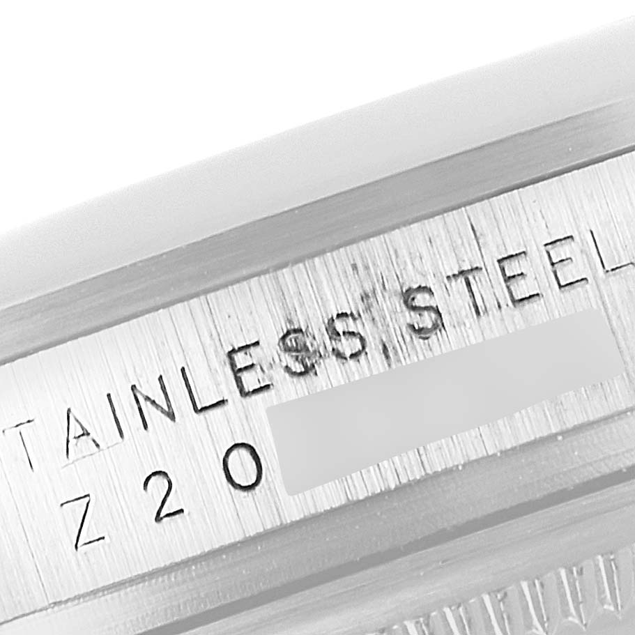 This image shows a close-up of the stainless steel case with engraving on a Rolex Explorer 114270 Men's Stainless Steel Black Dial 114270 Men's Stainless Steel Black Dial watch.