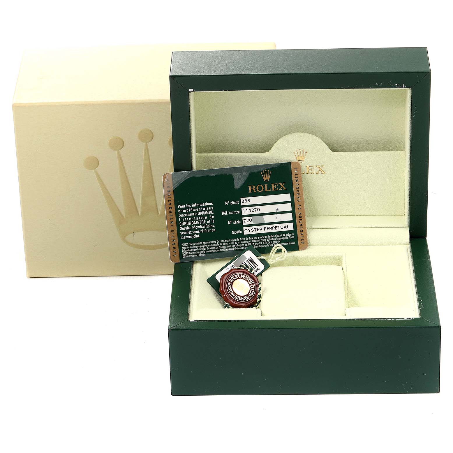 This image shows the packaging, warranty card, and tags for a Rolex Explorer 114270 Men's Stainless Steel Black Dial 114270 Men's Stainless Steel Black Dial watch, with an open green box and additional beige box.