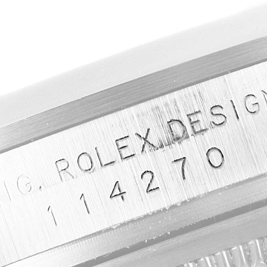 The image shows the side engraving with the model number on a Rolex Explorer 114270 Men's Stainless Steel Black Dial 114270 Men's Stainless Steel Black Dial watch.