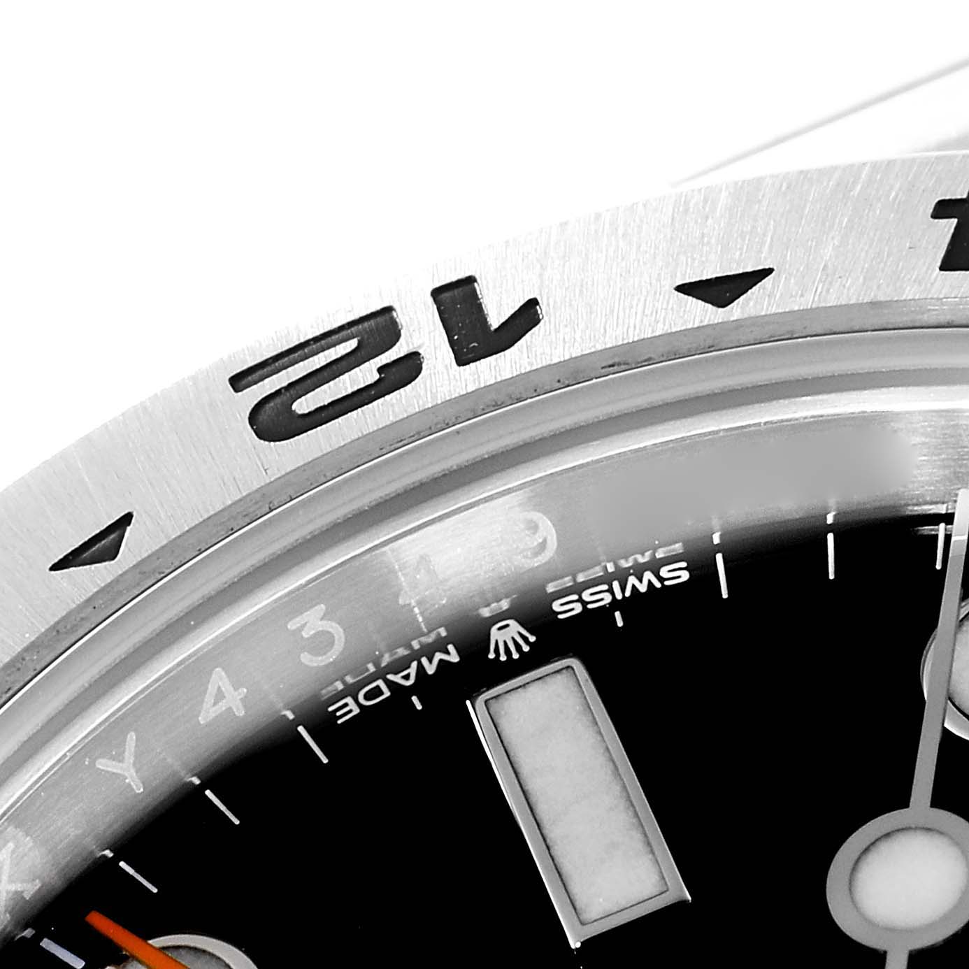 The image shows a close-up of the bezel and part of the dial of a Rolex Explorer 226570 Men's Stainless Steel Black Dial 226570 Men's Stainless Steel Black Dial watch.