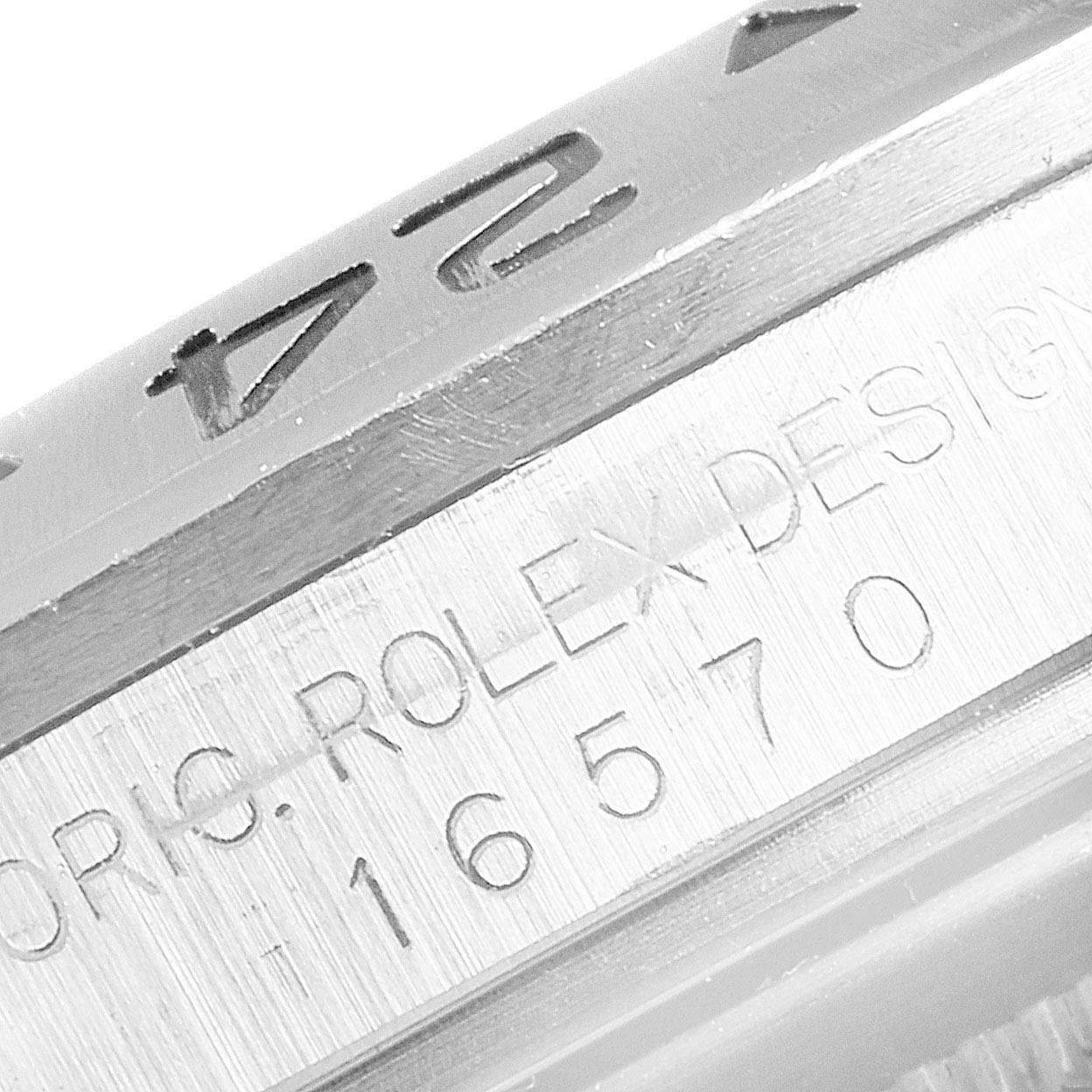 This image shows an up-close view of the engraved bezel and the side of the case on a Rolex Explorer 16570 Men
s Stainless Steel Black Dial 16570 Men
s Stainless Steel Black Dial model.