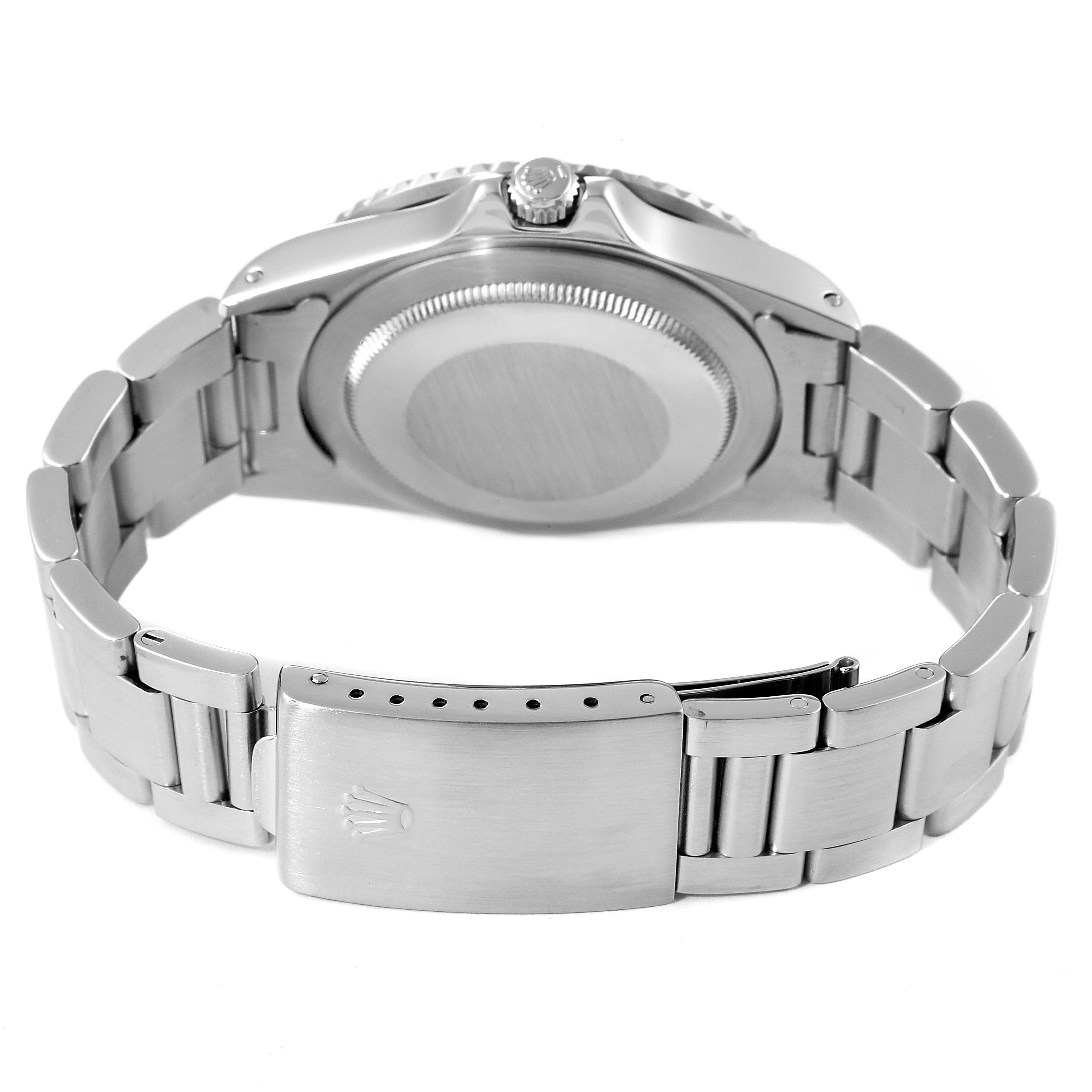 The image shows the back view of a Vintage Collection model by Rolex, highlighting the bracelet, clasp, and case back.