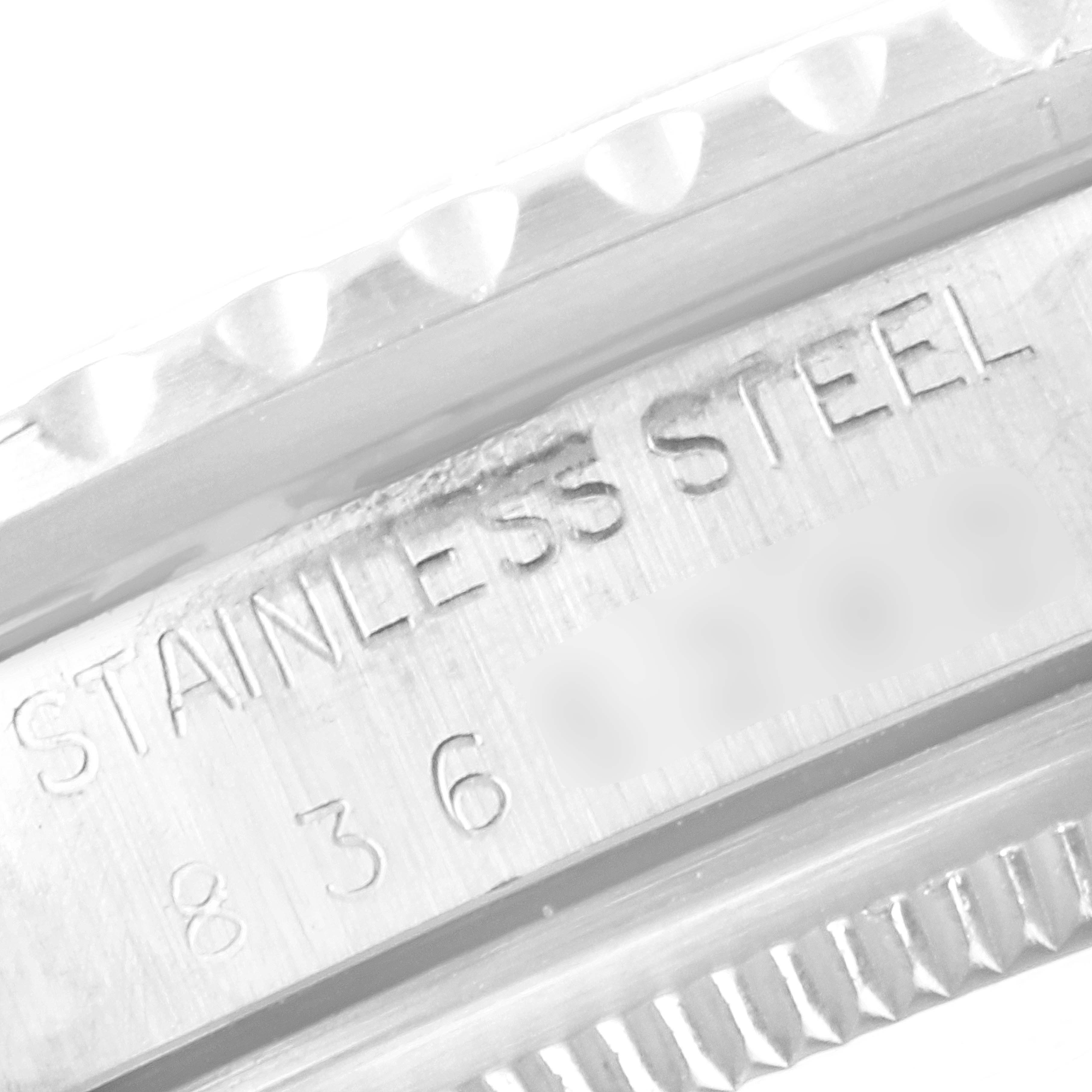 This close-up image shows the etched "STAINLESS STEEL" and the serial number on the case of the Rolex Vintage Collection 16750 Men's Stainless Steel Black Dial 16750 Men's Stainless Steel Black Dial watch.