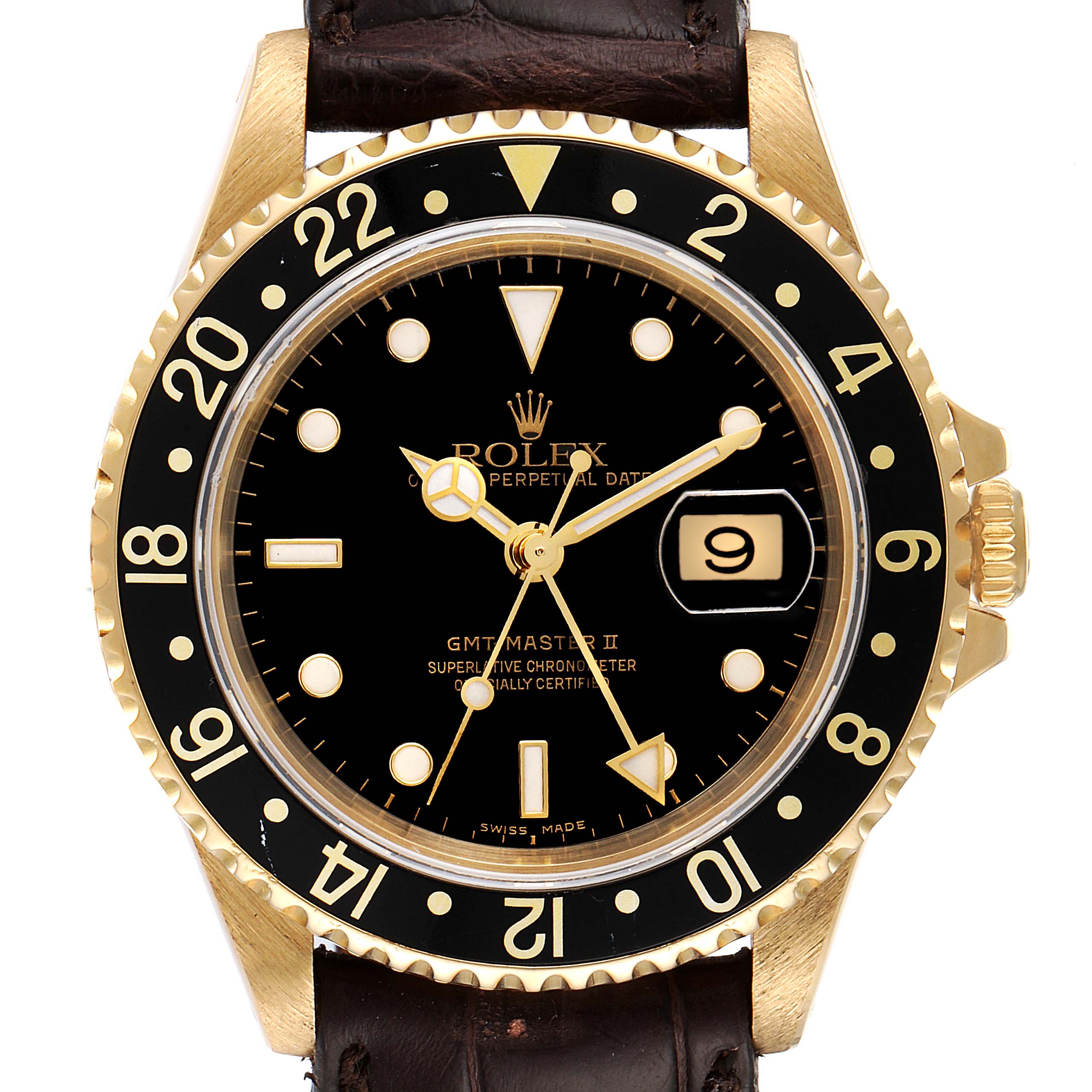 The image shows the dial of a Rolex GMT-Master 16718 Men
s Yellow Gold Black Dial 16718 Men
s Yellow Gold Black Dial II watch, highlighting its bezel, crown, and black face with date display.