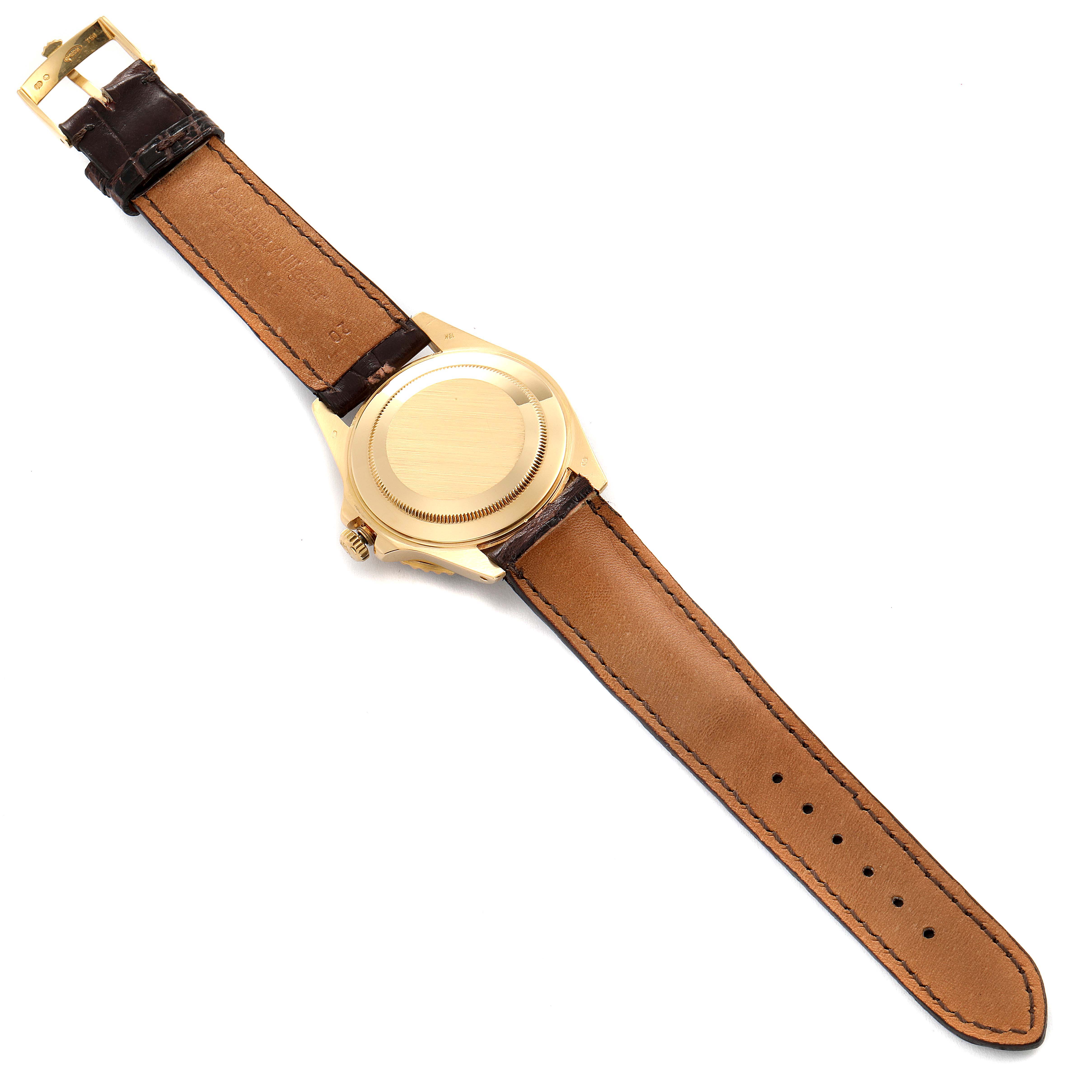 The image shows the back of a Rolex GMT-Master 16718 Men
s Yellow Gold Black Dial 16718 Men
s Yellow Gold Black Dial watch with a brown leather strap.