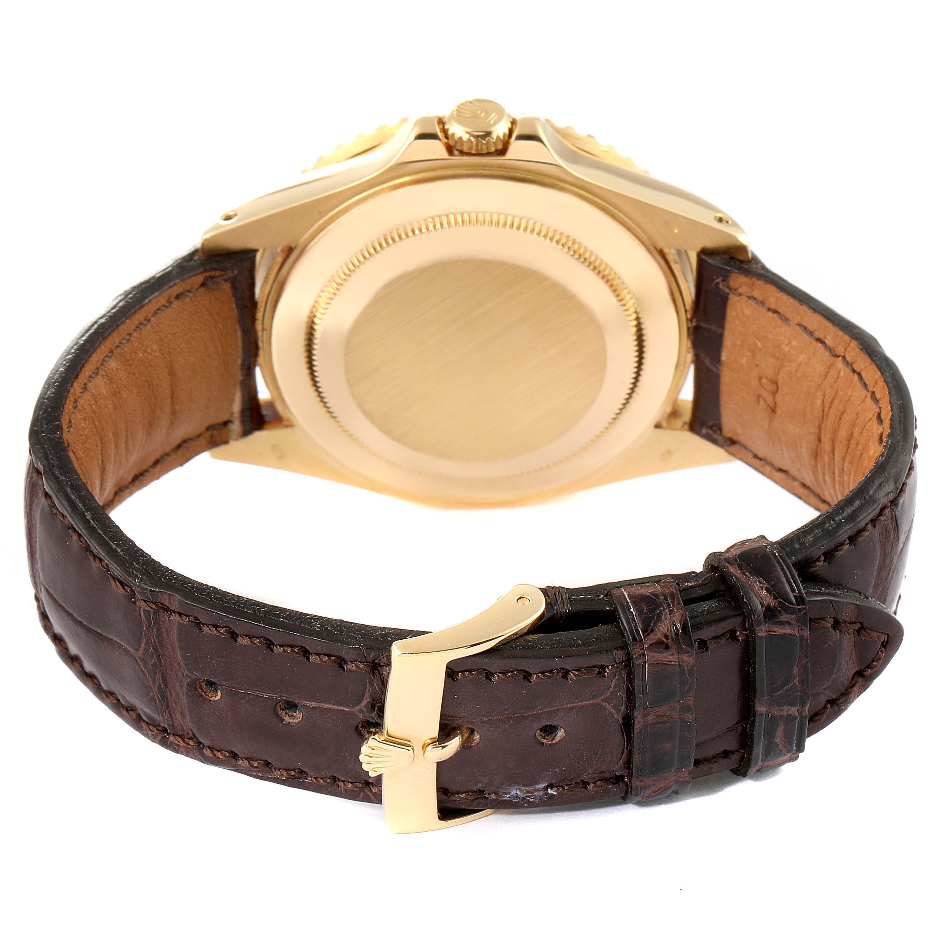 The image shows the back view of a Rolex GMT-Master 16718 Men
s Yellow Gold Black Dial 16718 Men
s Yellow Gold Black Dial watch, highlighting its case back and leather strap with buckle.