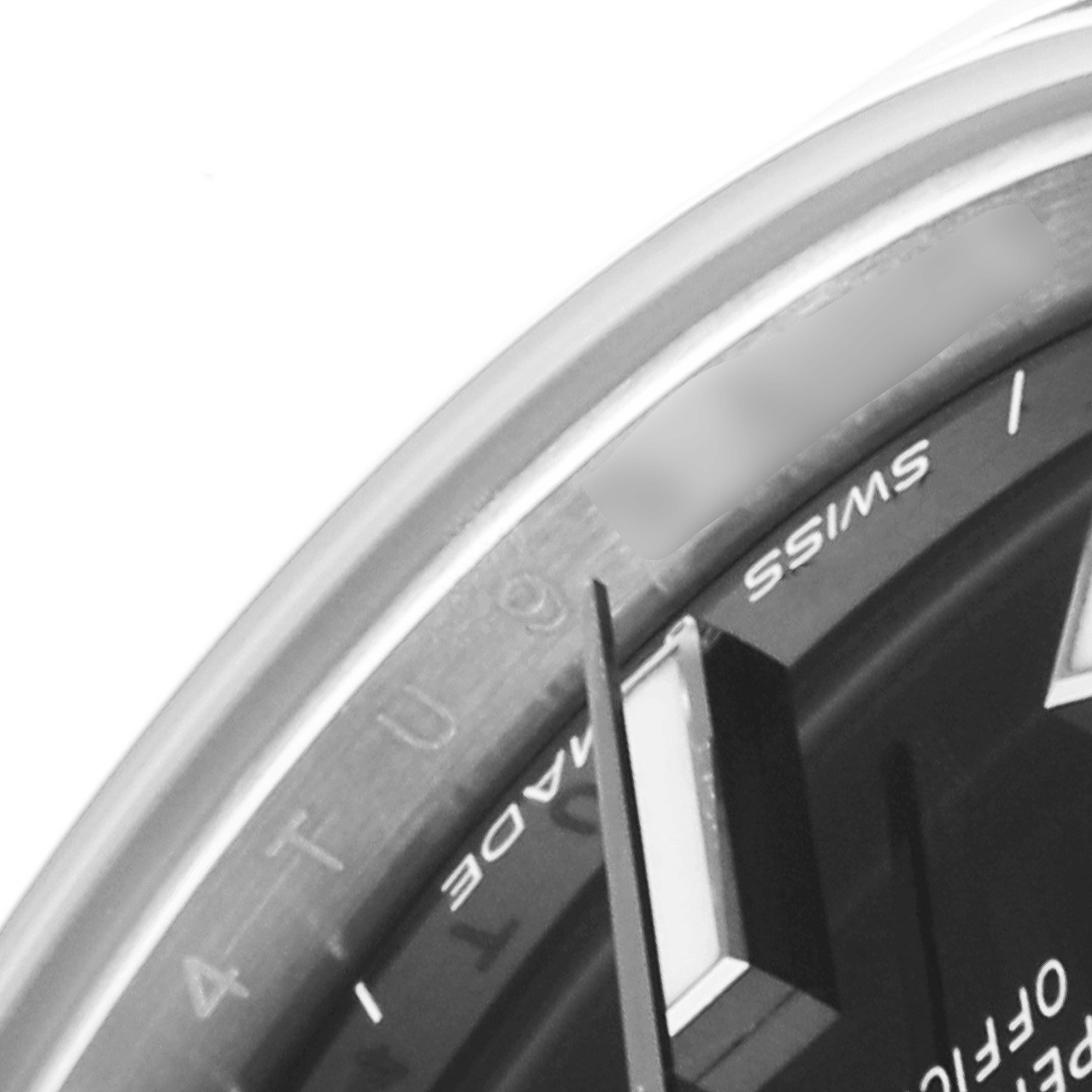 The image shows a close-up view of the dial and part of the bezel of a Rolex Mid-Size 277200 Women's Stainless Steel Black Dial 277200 Women's Stainless Steel Black Dial watch.
