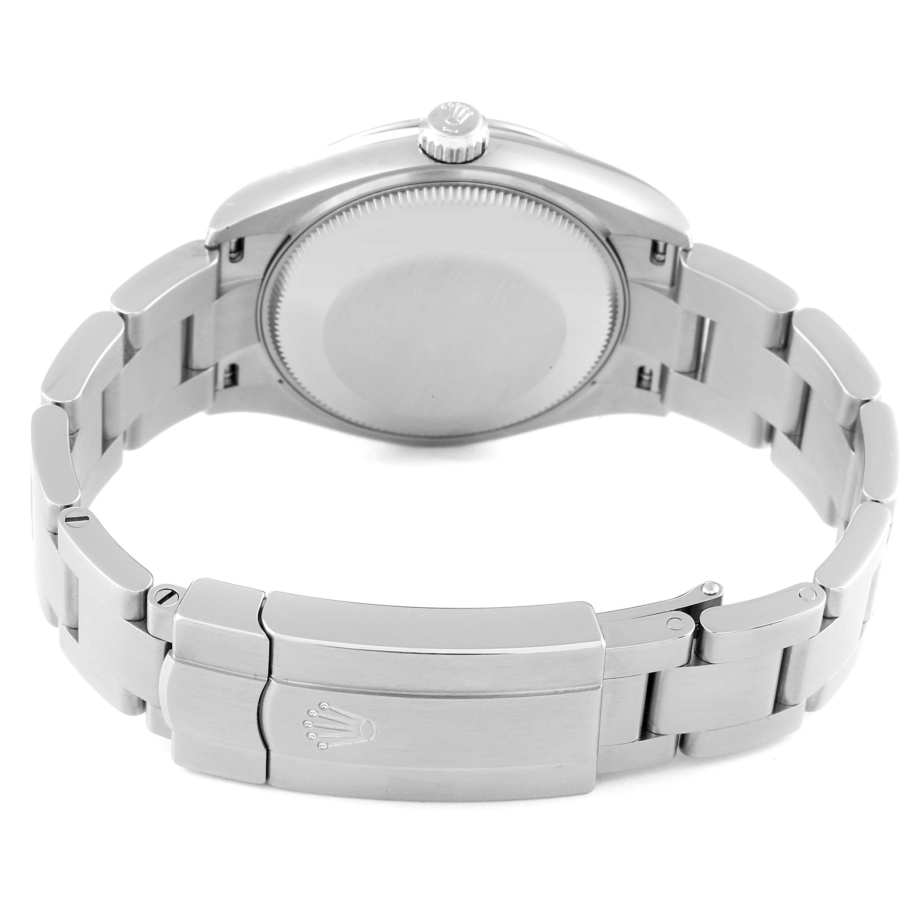 This image shows the back case, crown, and bracelet clasp of a Mid-Size Rolex watch from a rear angle.