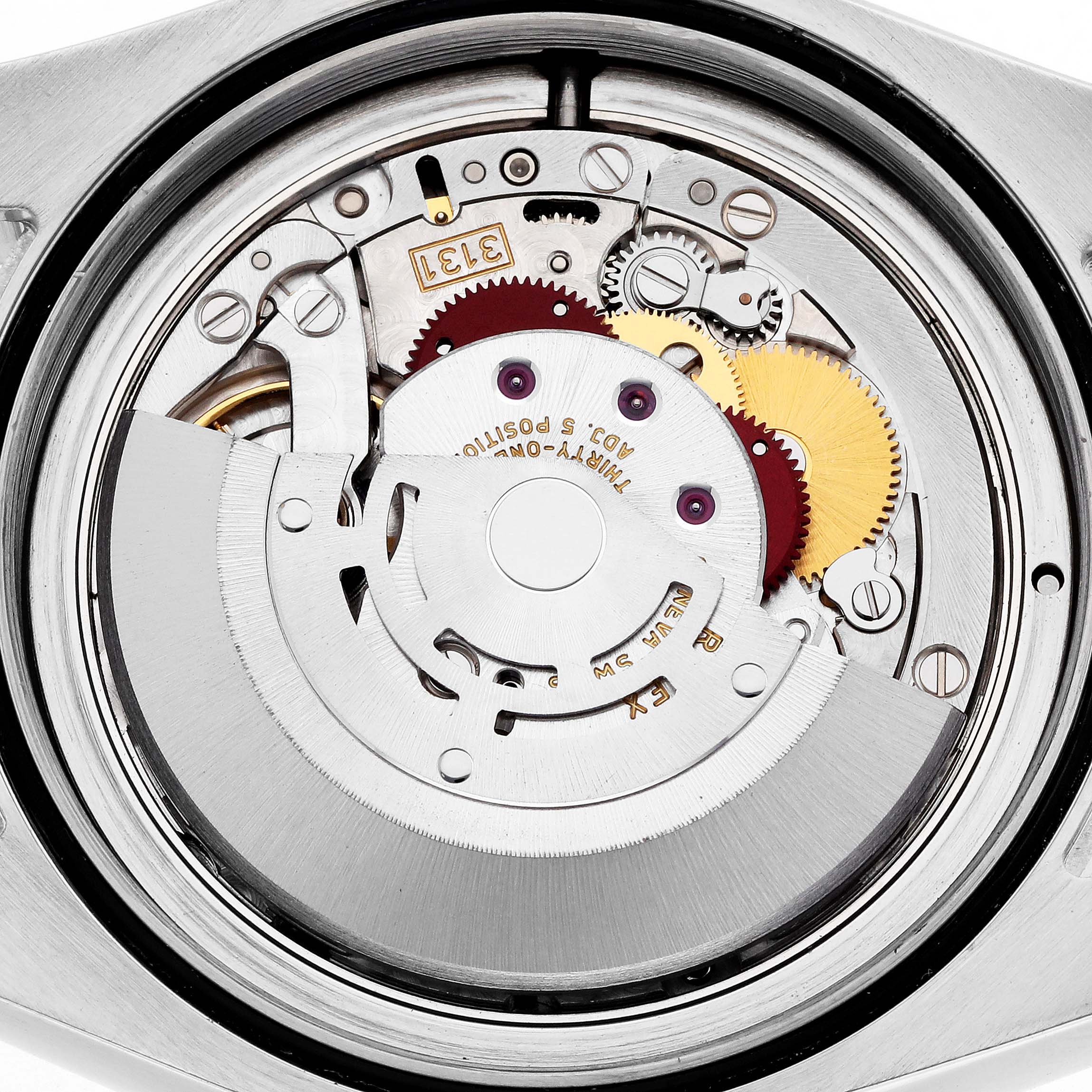 The image shows the inner mechanism of a Rolex Milgauss 116400 Men's Stainless Steel Blue Dial watch from a top-down angle, highlighting its movement components.