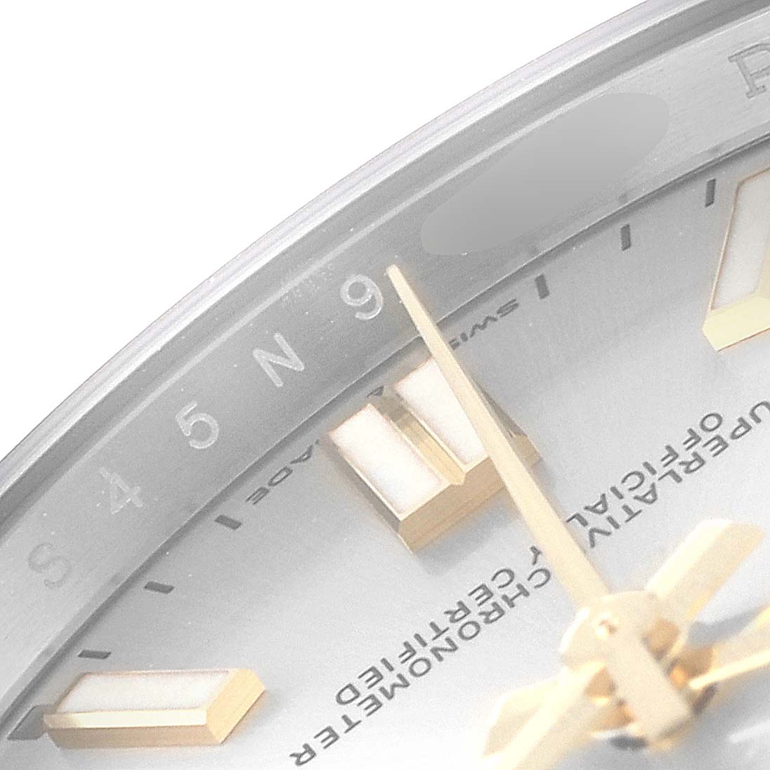 The image shows a close-up angle of the dial of a Rolex Oyster Perpetual 124300 Men's Stainless Steel Silver Dial 124300 Men's Stainless Steel Silver Dial watch, highlighting the hands, hour markings, and part of the bezel.