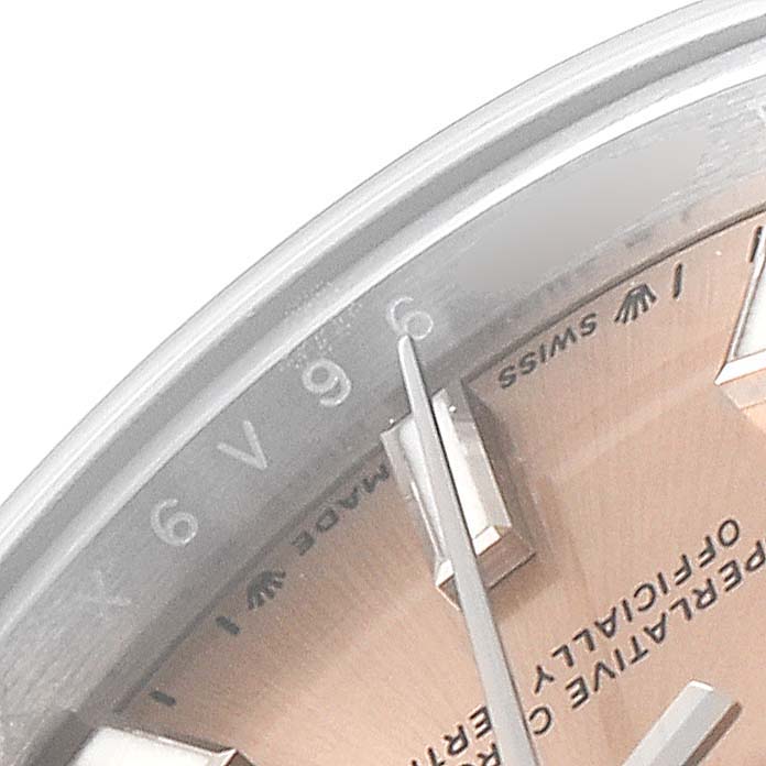 This image shows a close-up of the face and dial of a Rolex Oyster Perpetual 276200 Women
s Stainless Steel Pink Dial 276200 Women
s Stainless Steel Pink Dial watch, highlighting the hour markers and text.
