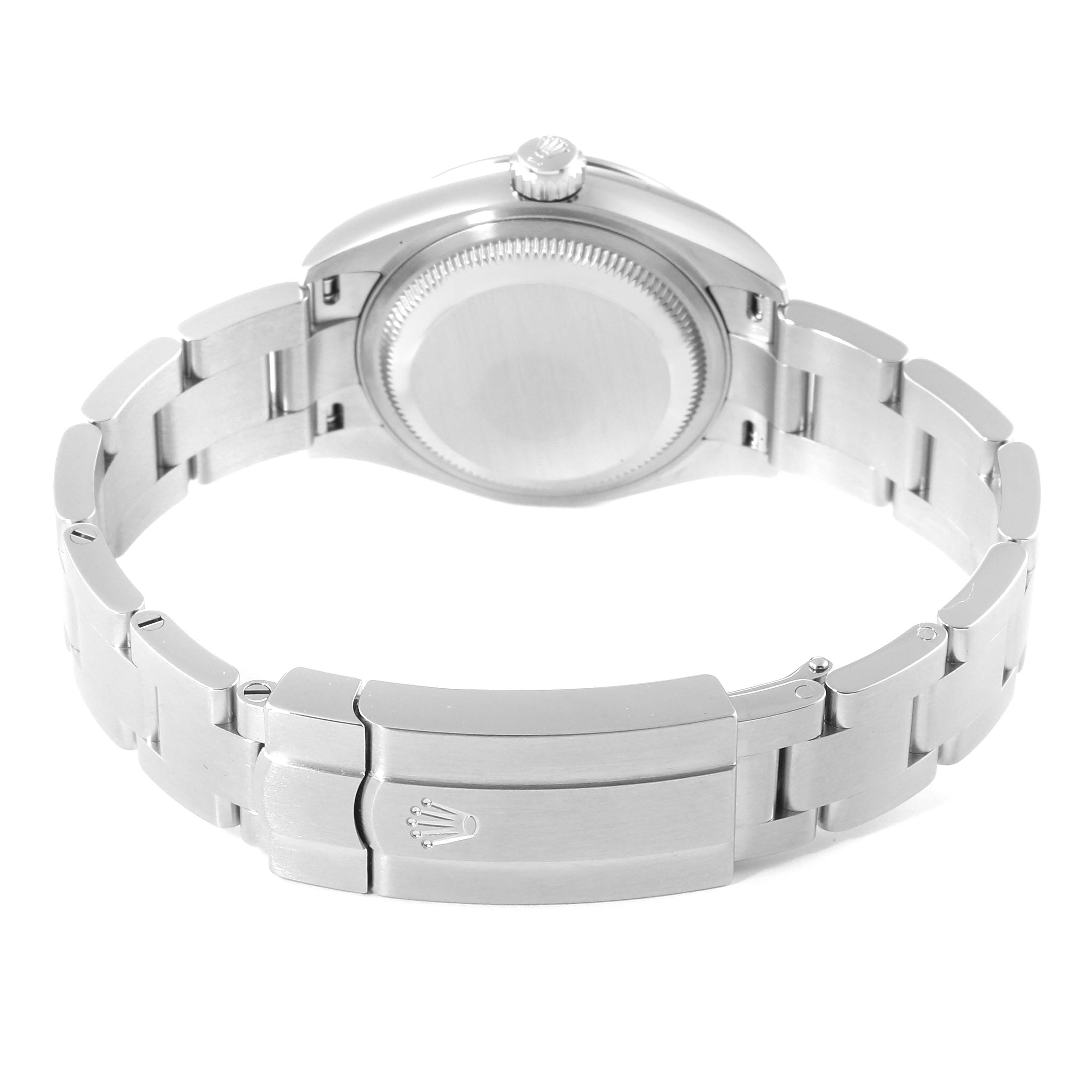 The image shows the backside of the Rolex Oyster Perpetual 276200 Women
s Stainless Steel Pink Dial 276200 Women
s Stainless Steel Pink Dial watch, displaying the clasp and the back of the case.