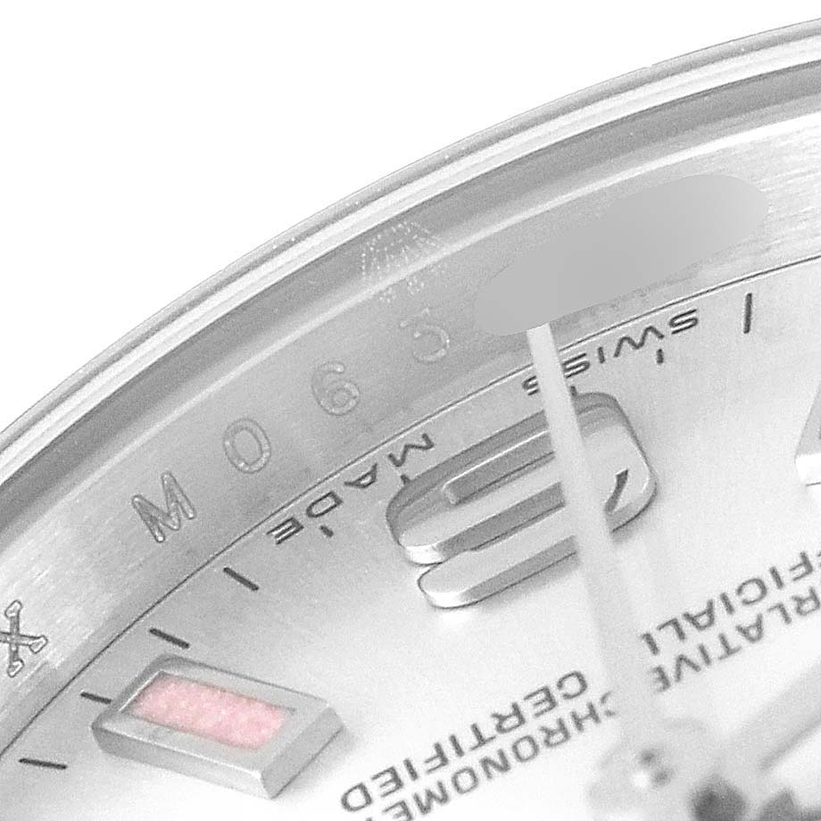 This close-up angle of the Rolex Oyster Perpetual 176200 Women's Stainless Steel Silver Dial 176200 Women's Stainless Steel Silver Dial watch shows part of the dial, indices, and text including "Swiss Made."