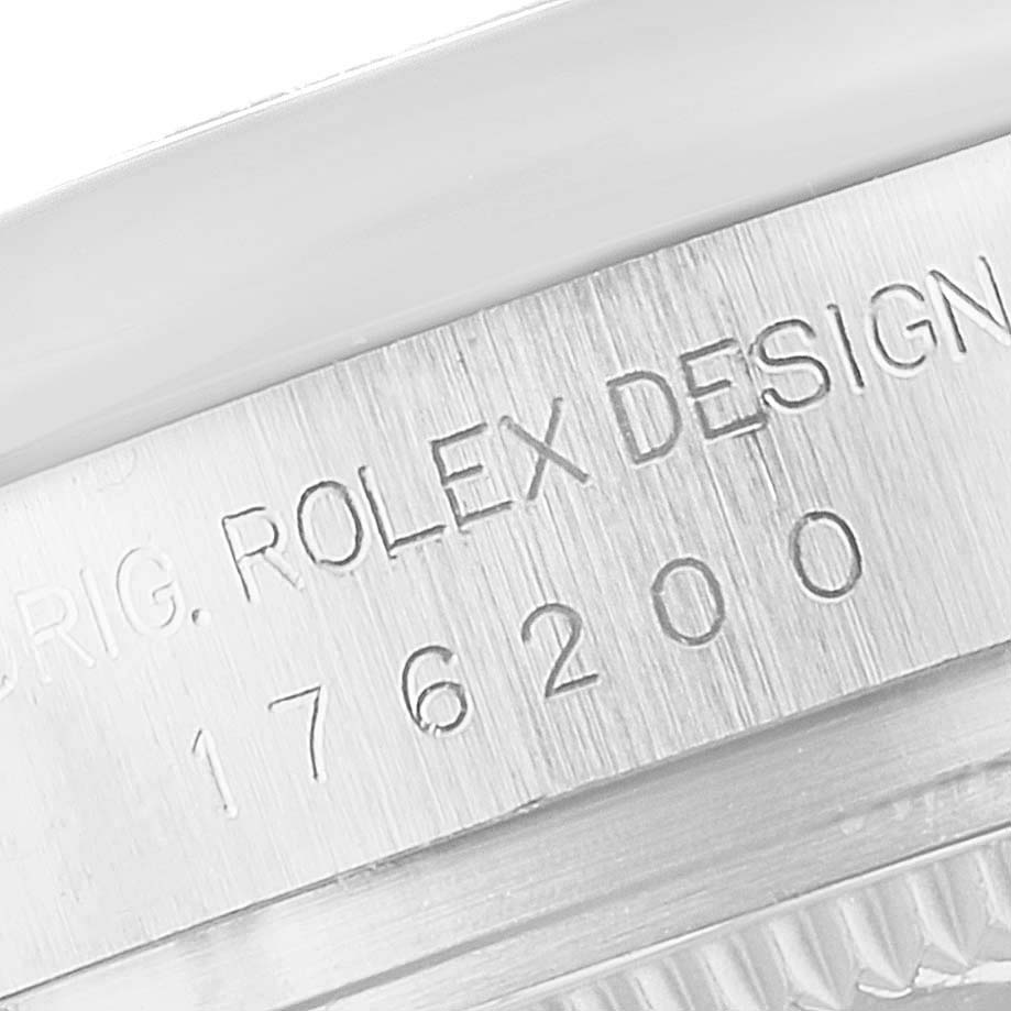This image shows a close-up of the case back edge with engravings on a Rolex Oyster Perpetual 176200 Women's Stainless Steel Silver Dial 176200 Women's Stainless Steel Silver Dial watch.
