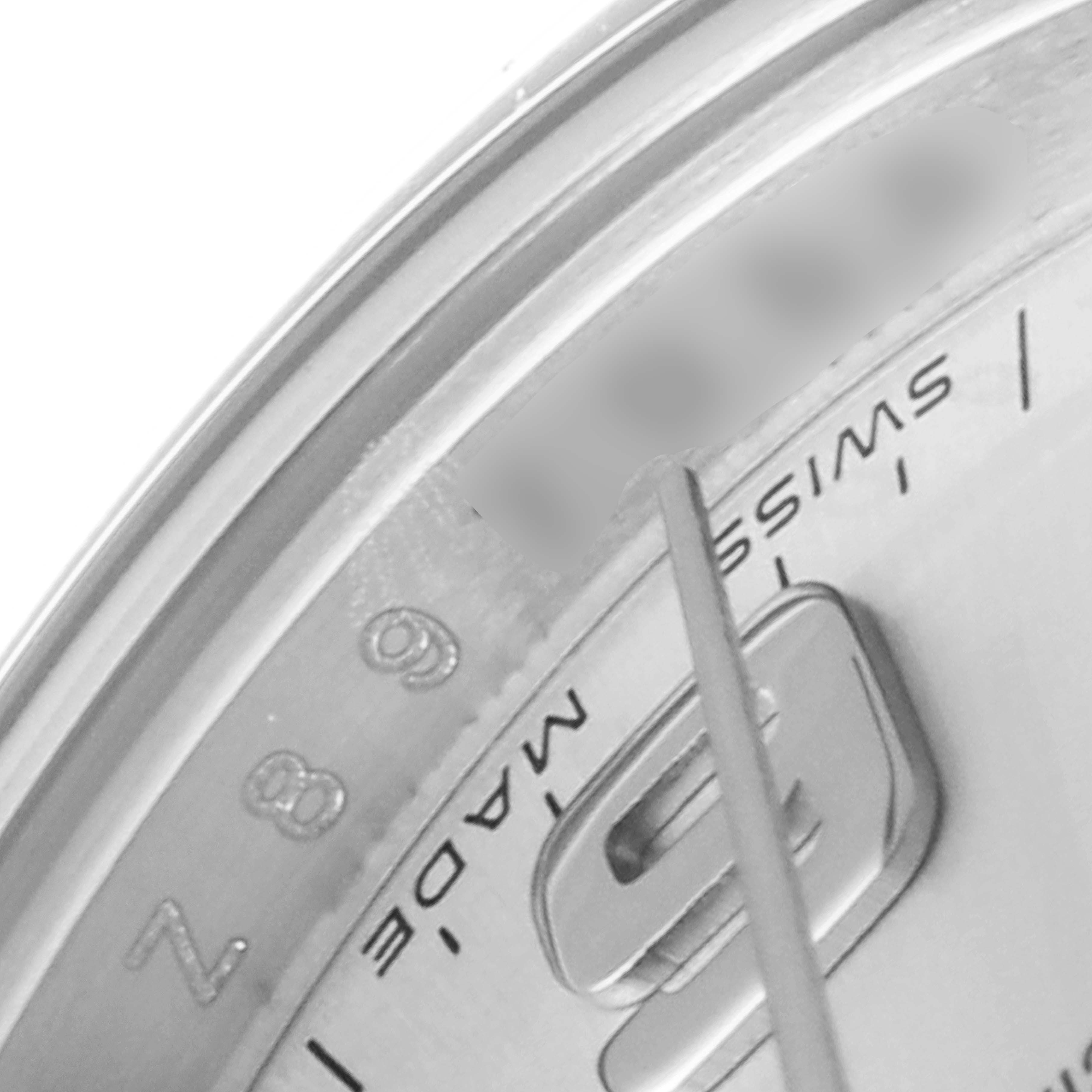 This close-up image shows the dial and part of the numeral marking of the Rolex Oyster Perpetual 176200 Women's Stainless Steel Silver Dial 176200 Women's Stainless Steel Silver Dial watch.