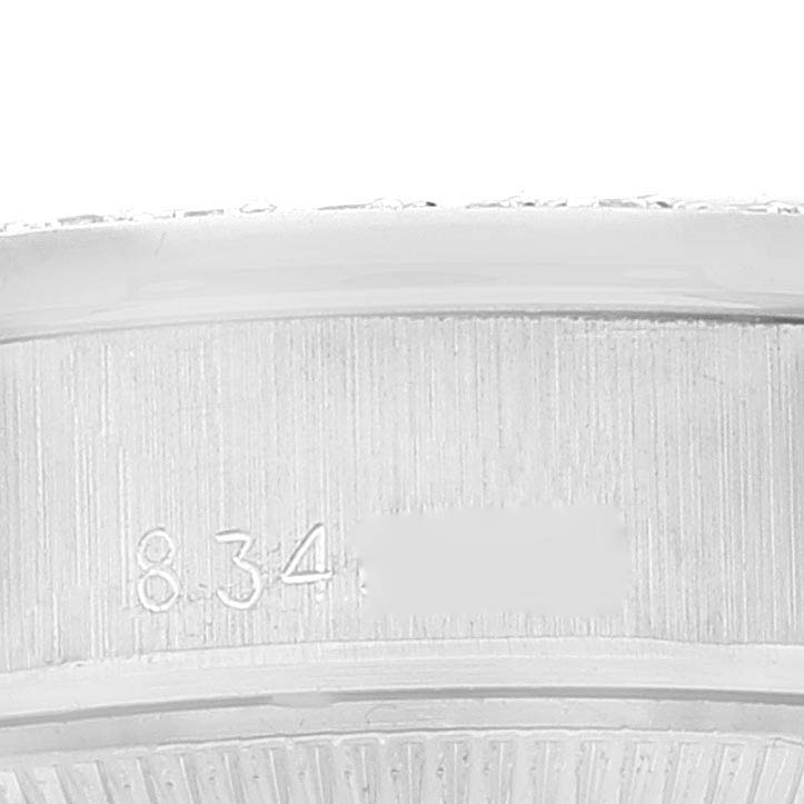 The image shows a close-up of the side of the bezel and case of the Rolex President 69139 Women
s White Gold Silver Dial 69139 Women
s White Gold Silver Dial model, focusing on the engraved numbers.