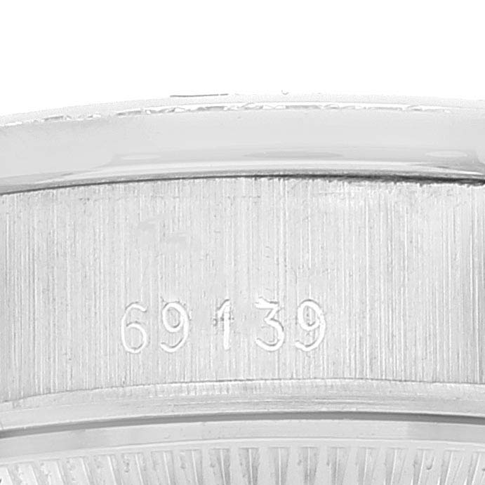 The image shows a close-up of the side of a Rolex President 69139 Women
s White Gold Silver Dial 69139 Women
s White Gold Silver Dial model watch, highlighting the engraved model number "69139."