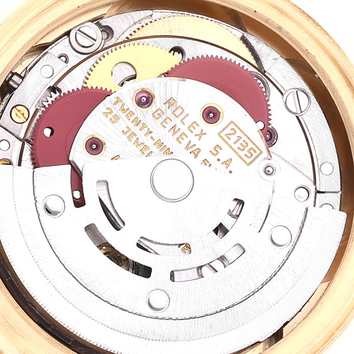 The image shows the internal mechanism of a Rolex President 69178 Women
s Yellow Gold Champagne Dial 69178 Women
s Yellow Gold Champagne Dial model, focusing on the gears and movement components.