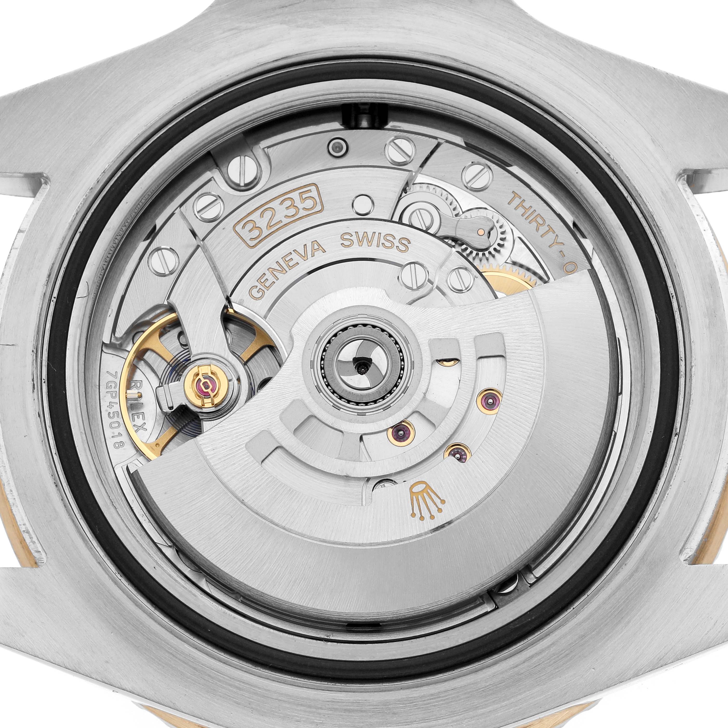 The image shows the movement mechanism of a Rolex Sea-Dweller 126603 Men
s Steel and Gold (two tone) Black Dial, viewed from the back with parts like the rotor and balance wheel visible.